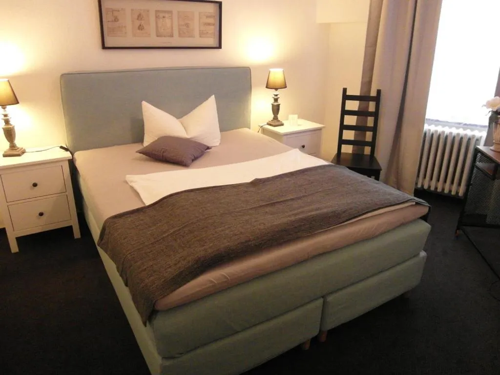 Bed in Hotel Frankfurter Hof