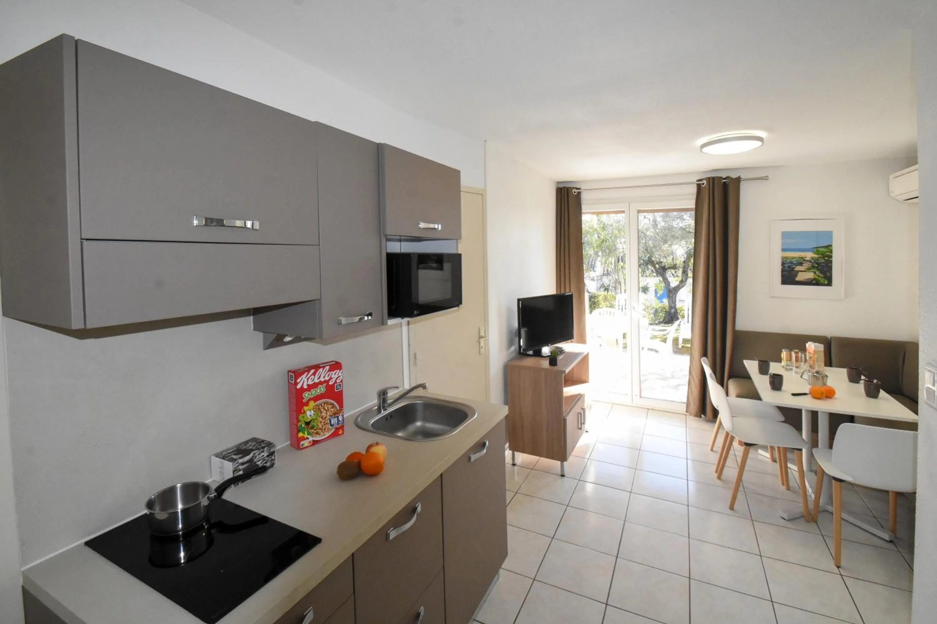 Kitchen or kitchenette in Residence La Palmeraie