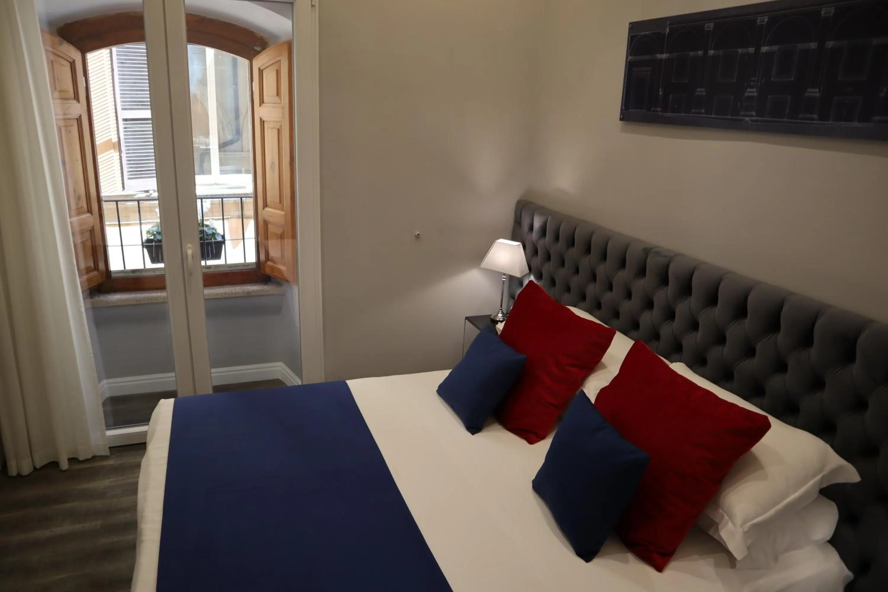 Photo of the whole room, Bed in MILLINA SUITES IN NAVONA