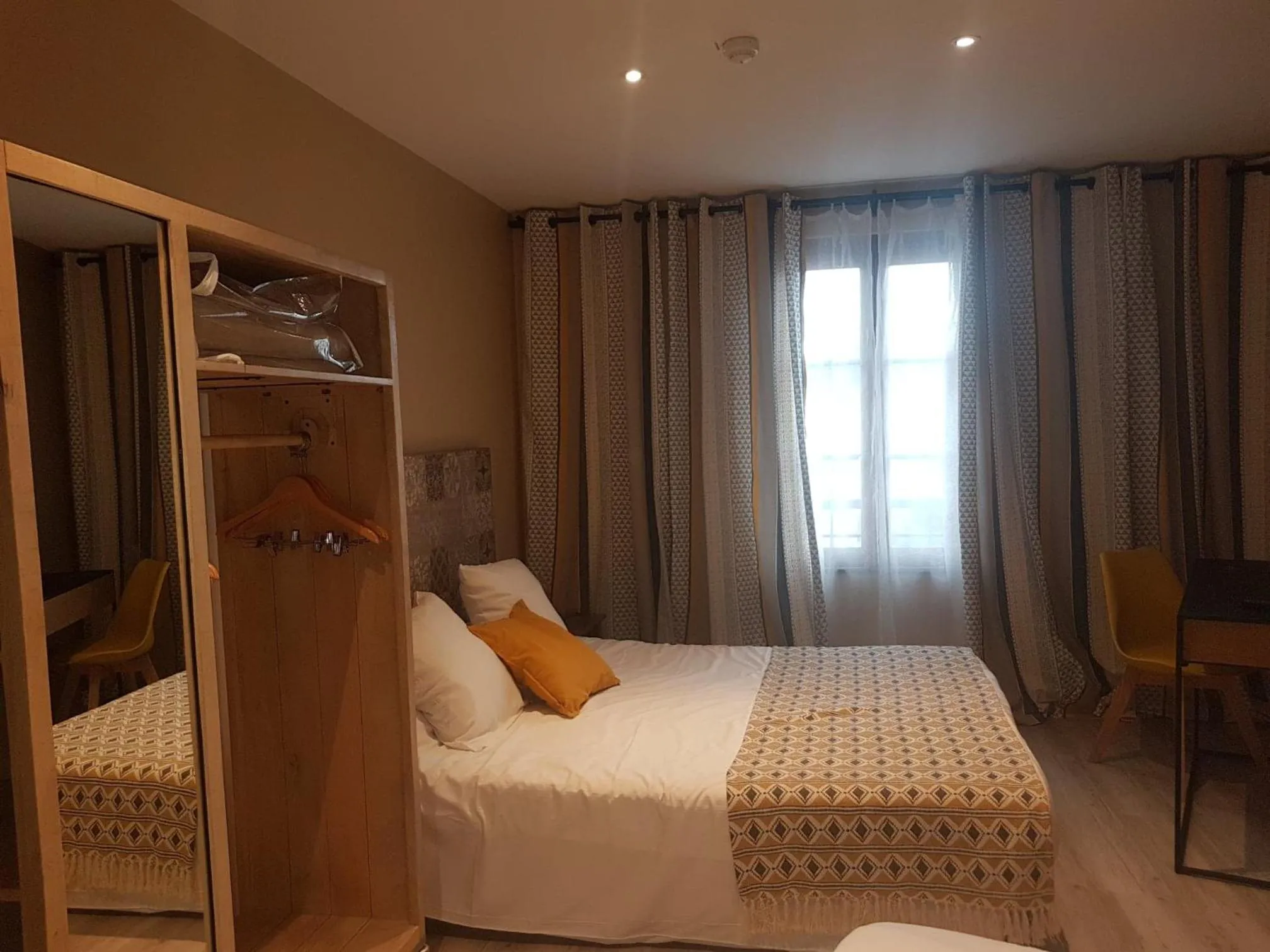 Bed in Logis Hôtel Terre de Loire