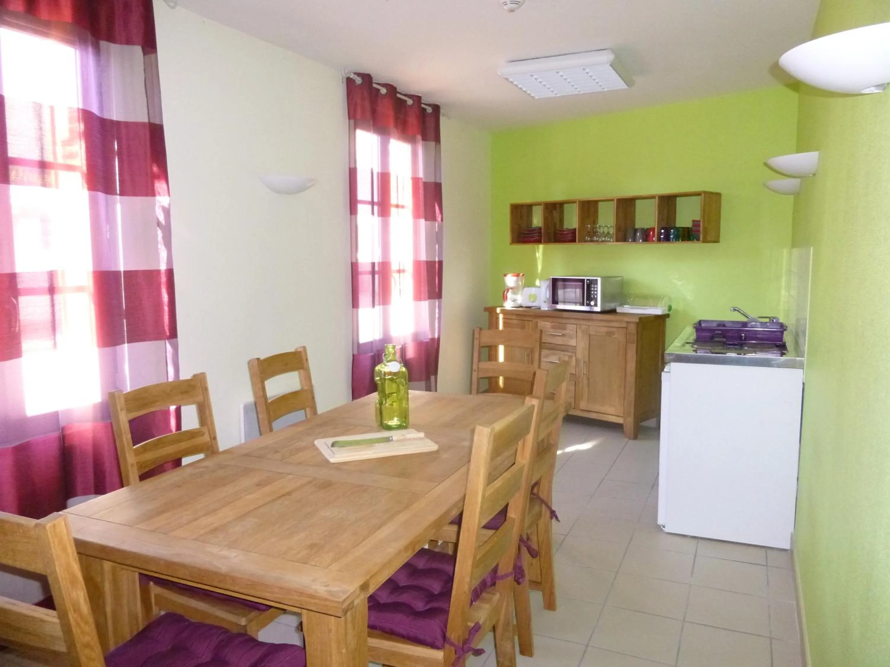 Kitchen or kitchenette in Logis Hôtel Terre de Loire