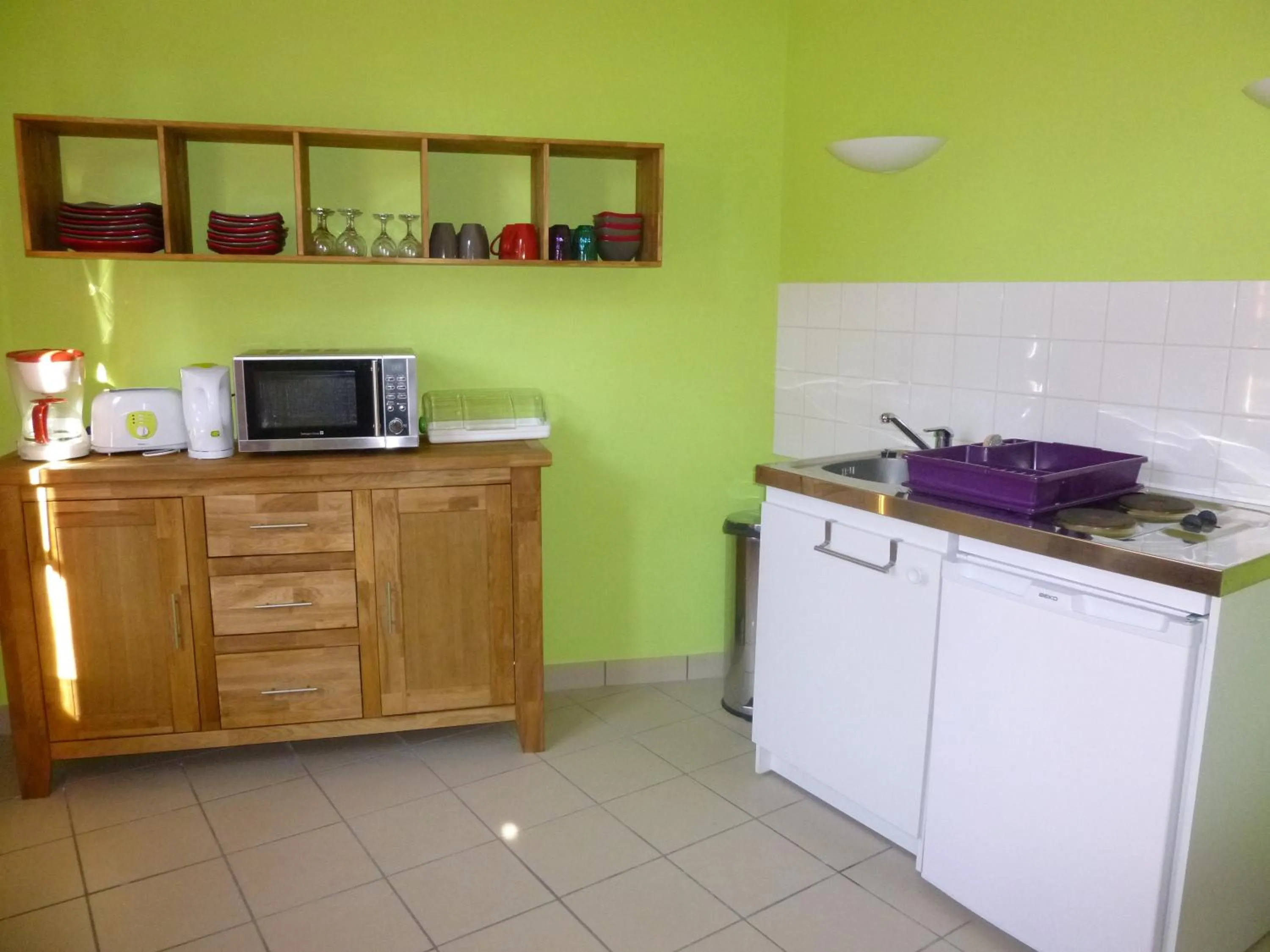 Kitchen or kitchenette in Logis Hôtel Terre de Loire