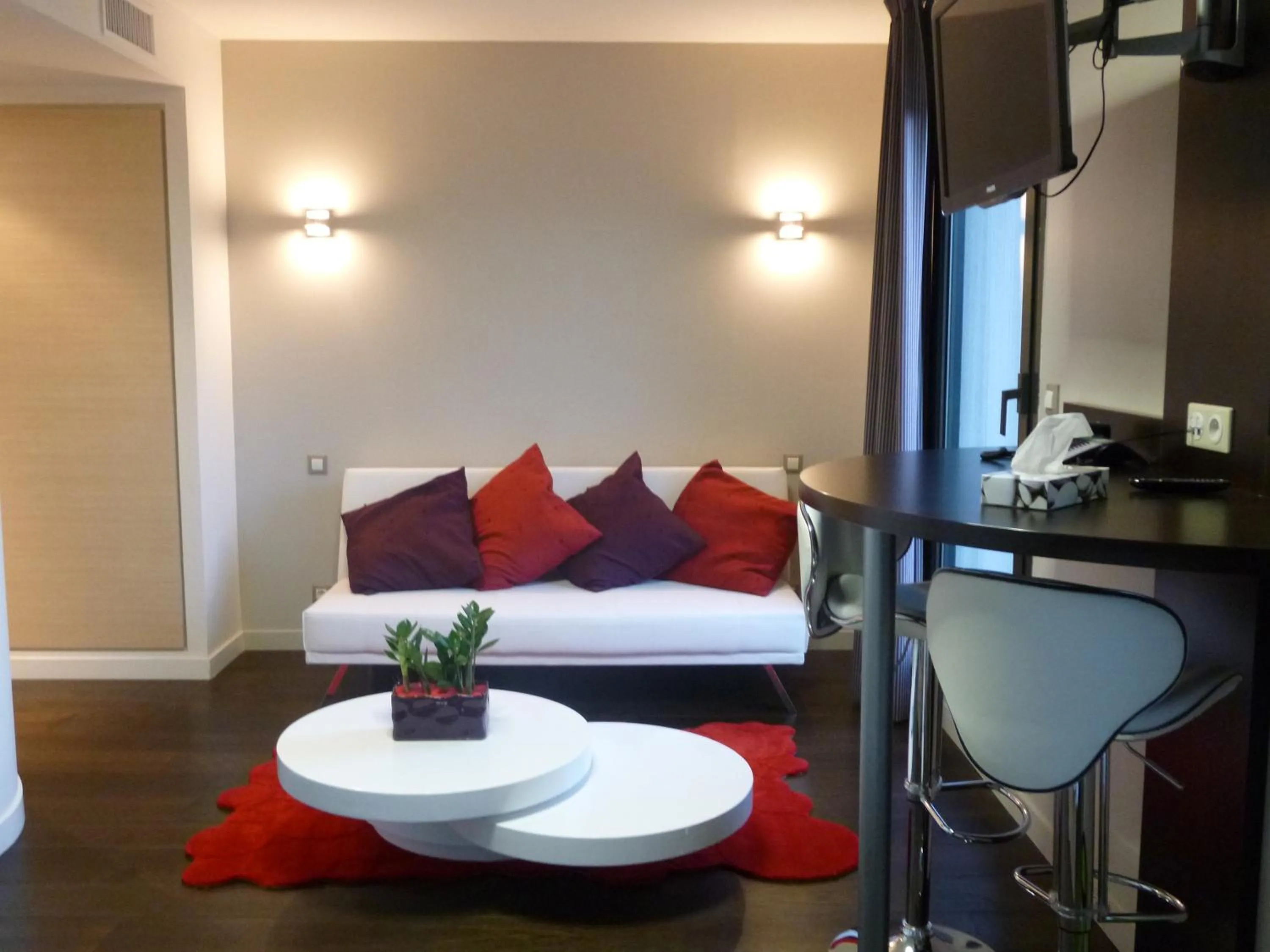 Living room, Bed in Logis Hôtel Terre de Loire