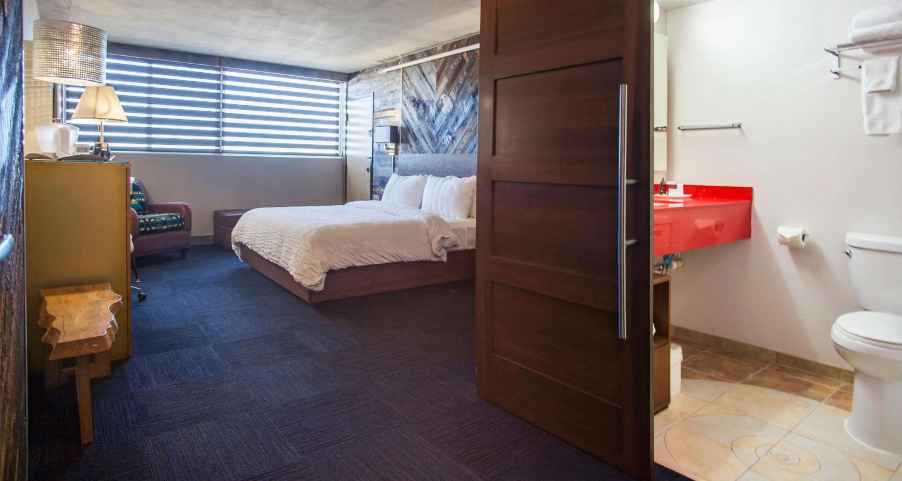 Photo of the whole room, Bed in The Rushmore Hotel & Suites; BW Premier Collection