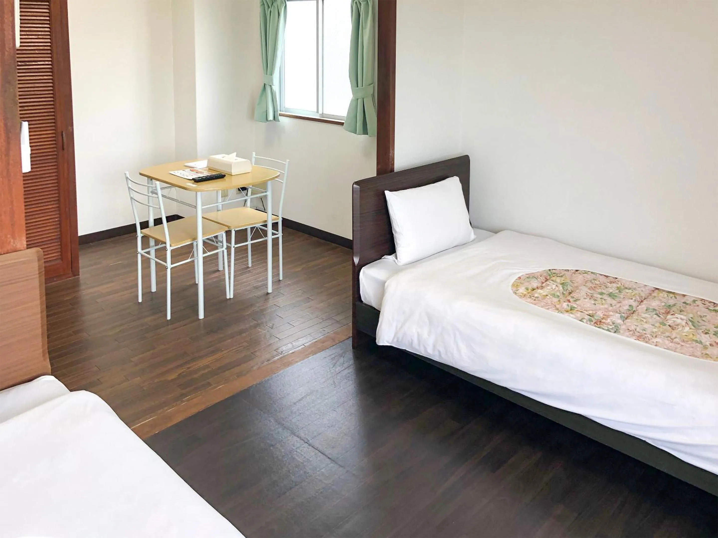 Bed in Sunset Hills Inn Naha