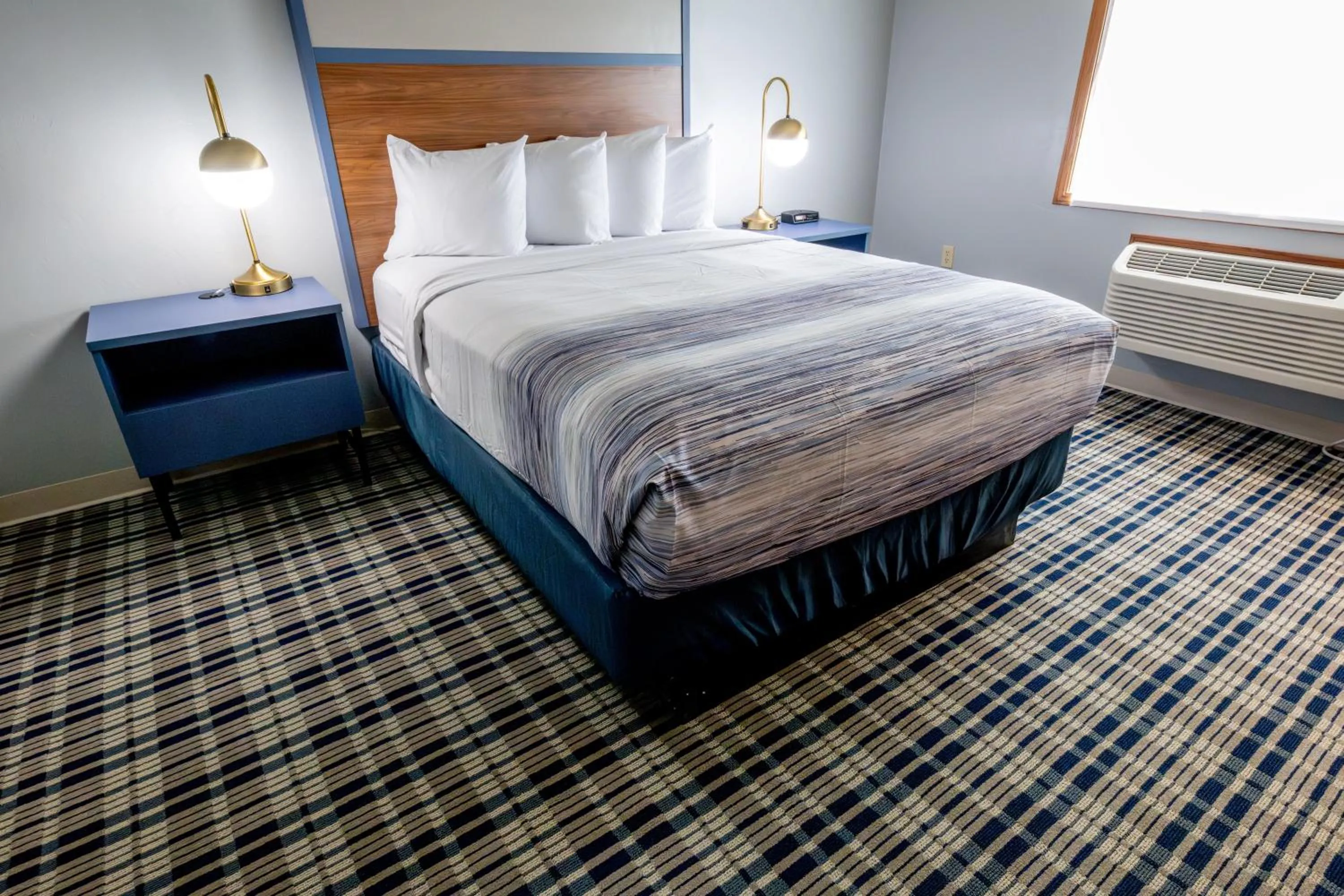 Bed in AmericInn by Wyndham Sturgeon Bay