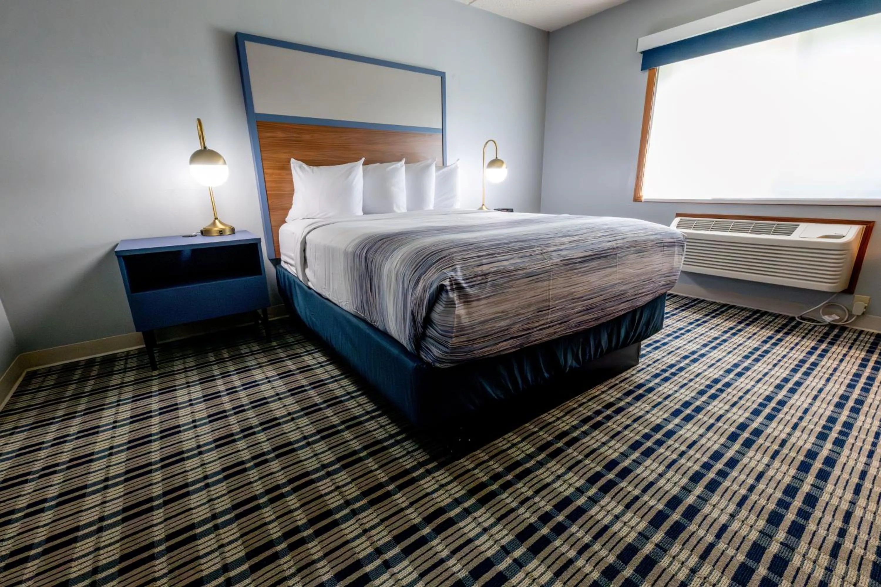 Bed in AmericInn by Wyndham Sturgeon Bay