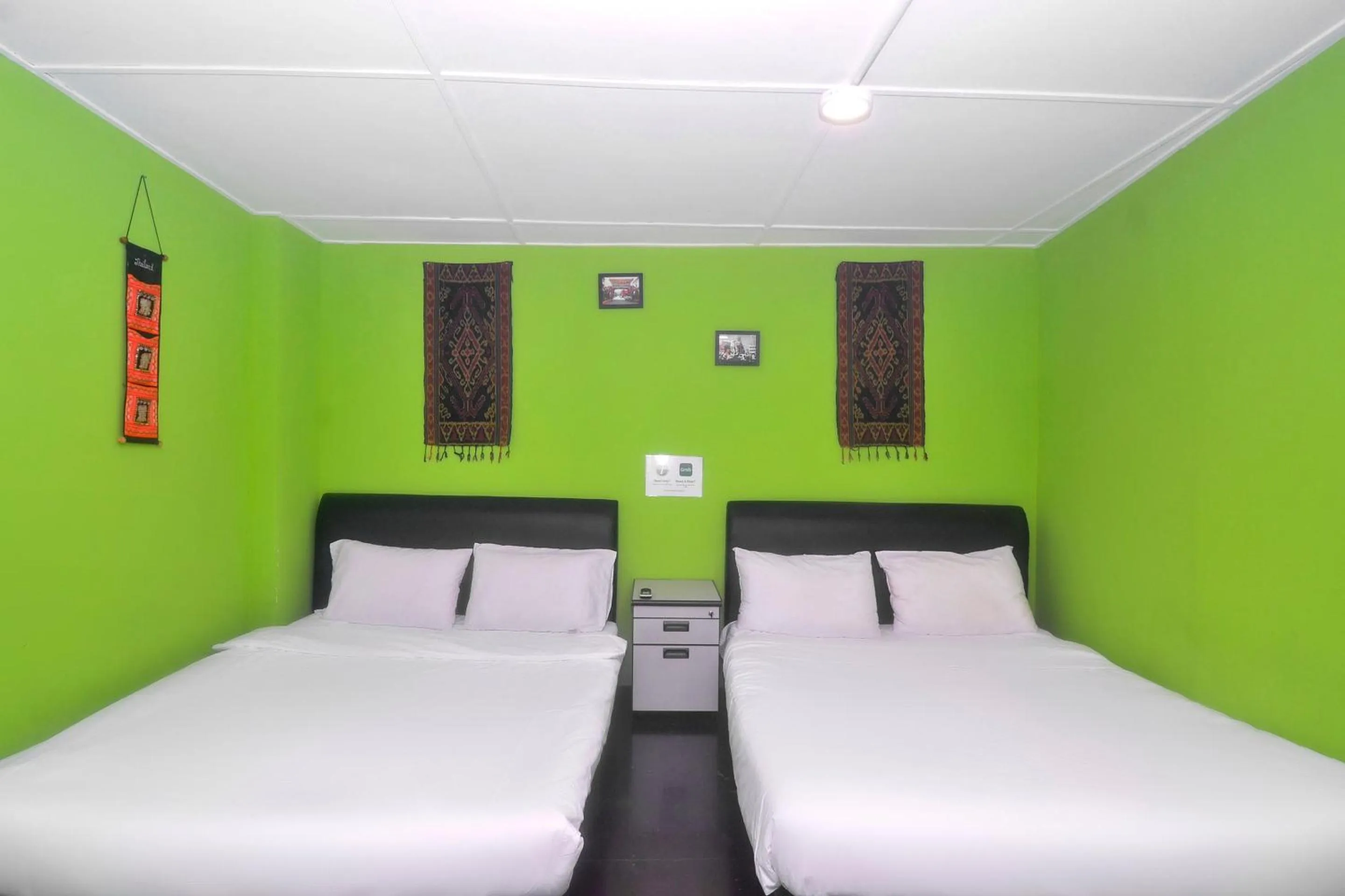 Bedroom in Hotel O Tropical Lodge