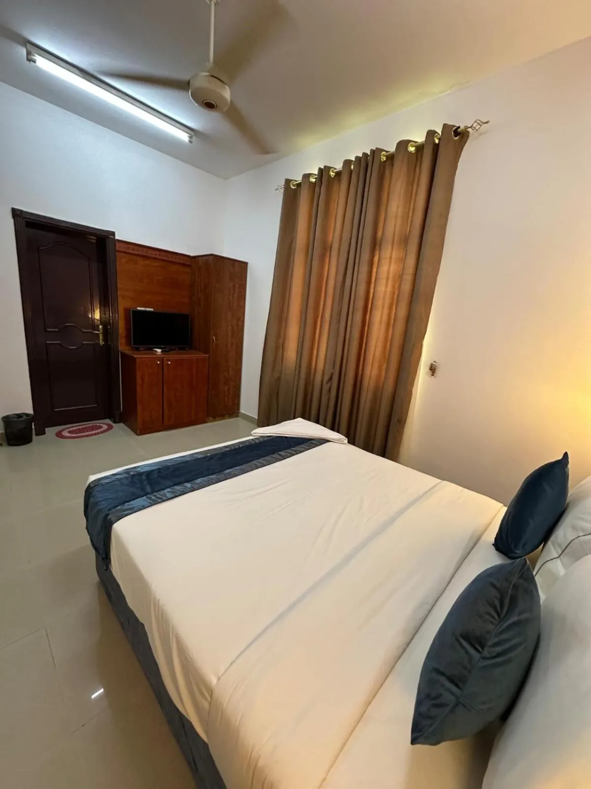 Bed in Savoy Inn Hotel Apartments