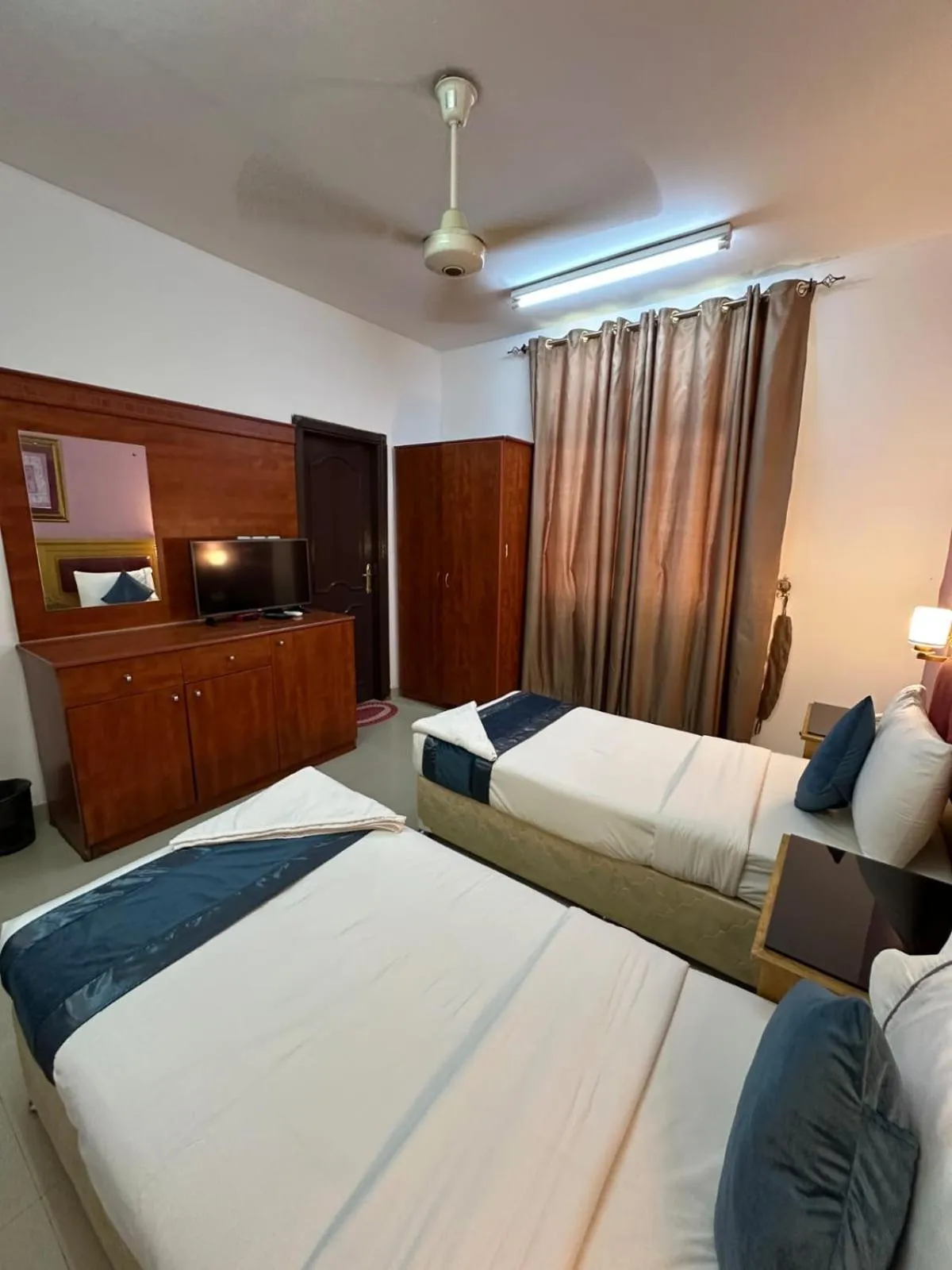 Bed in Savoy Inn Hotel Apartments