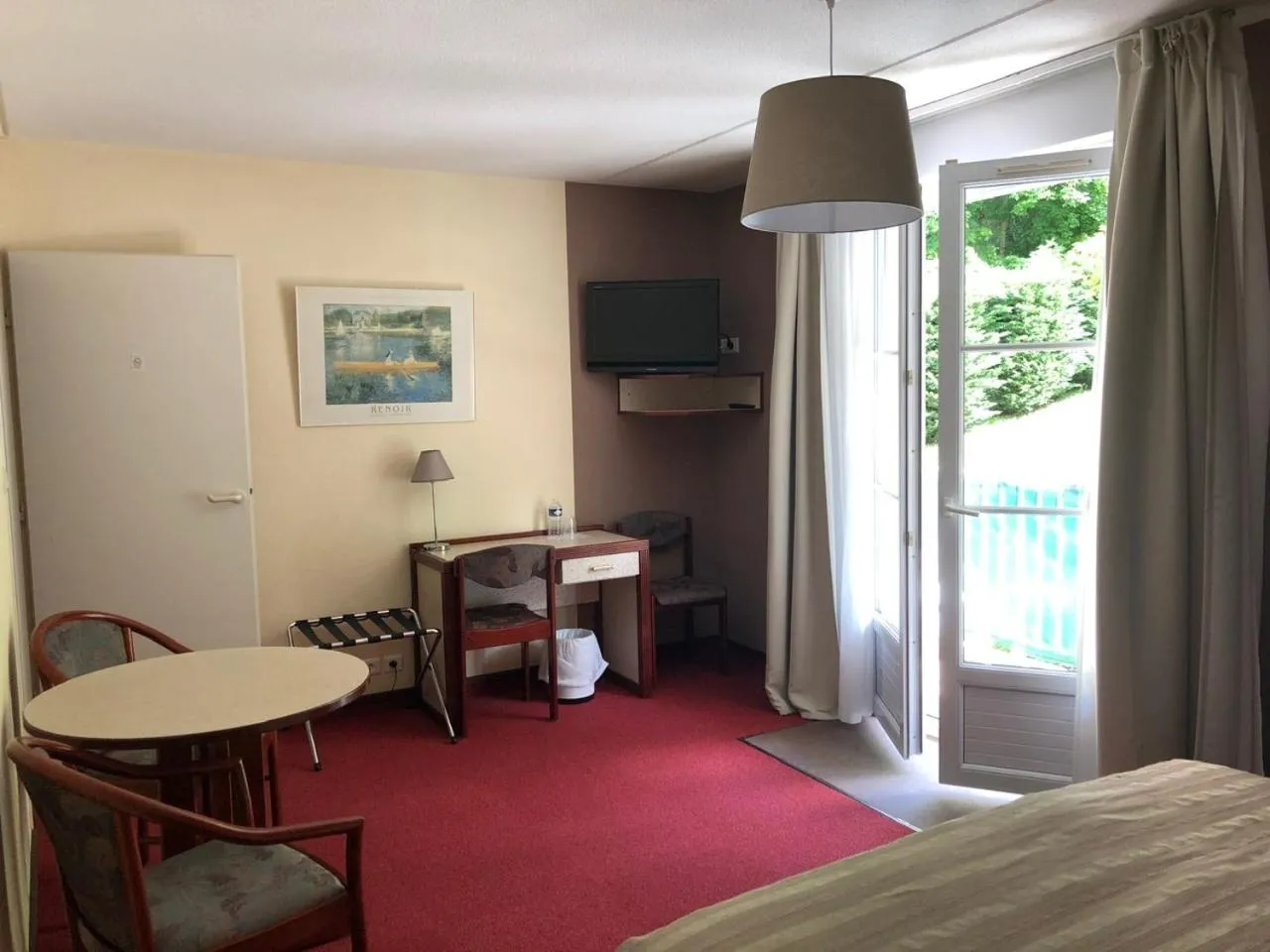 Bed in Hôtel et Studios d'Orfeuil