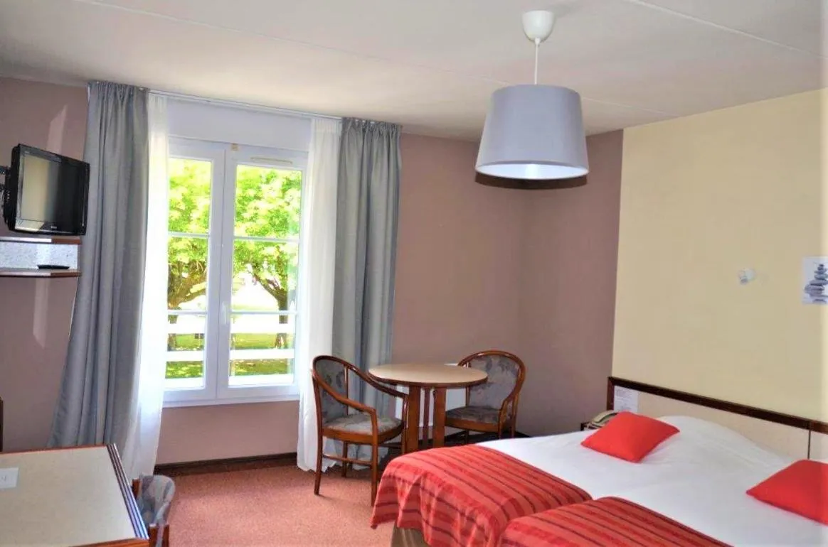 Bed in Hôtel et Studios d'Orfeuil