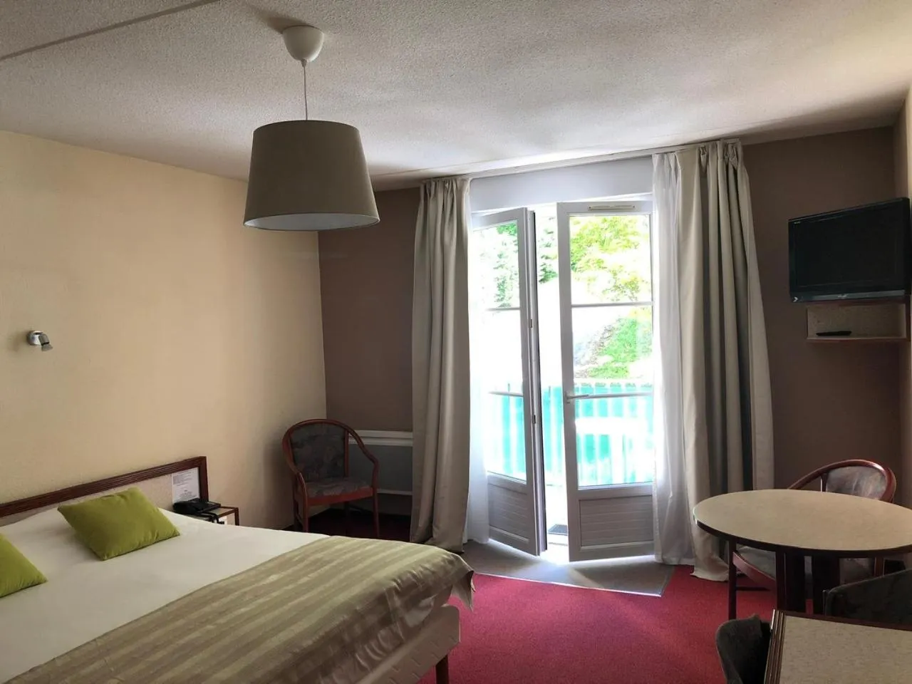 Bed in Hôtel et Studios d'Orfeuil