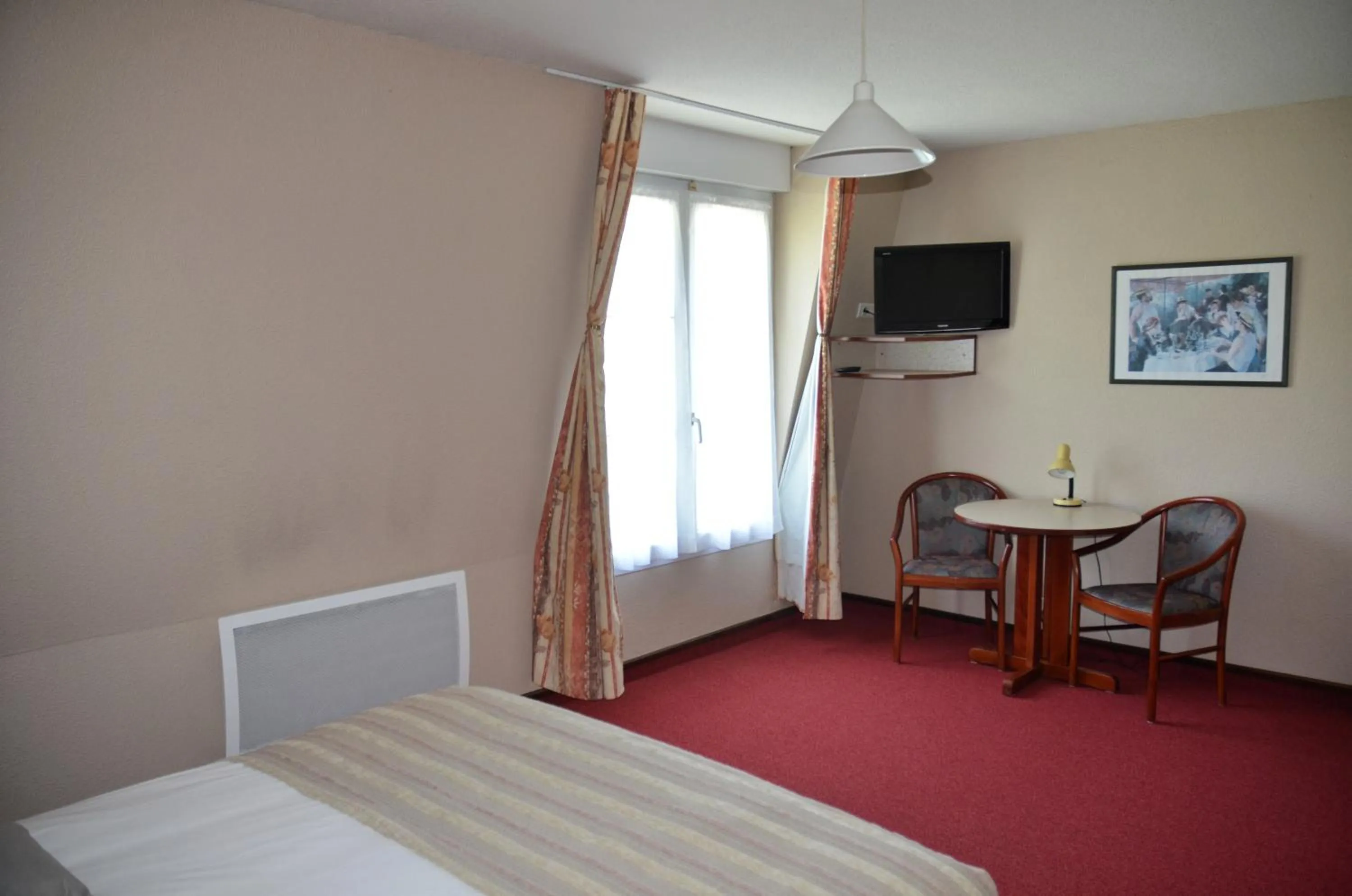 Bed in Hôtel et Studios d'Orfeuil