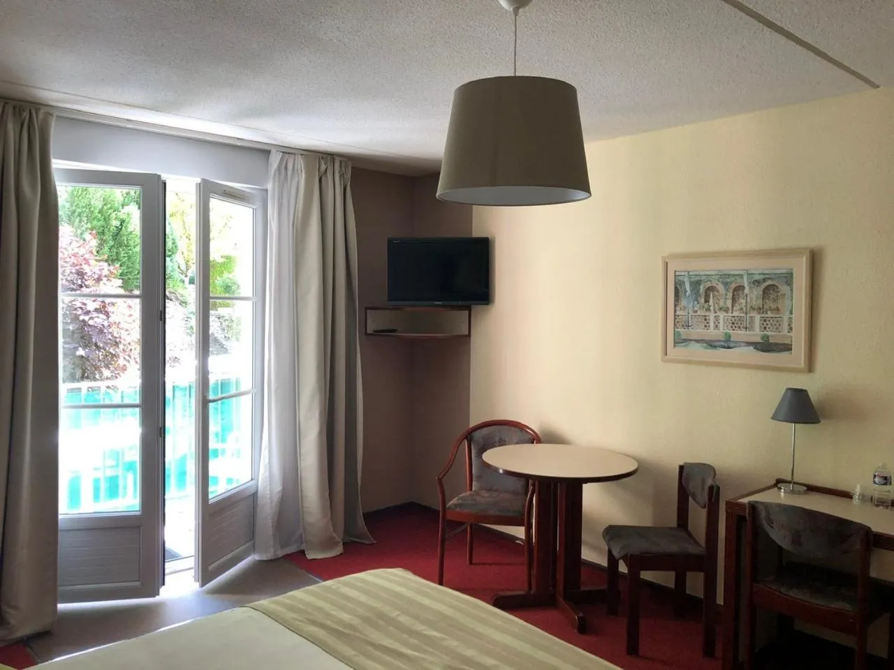 Bed in Hôtel et Studios d'Orfeuil