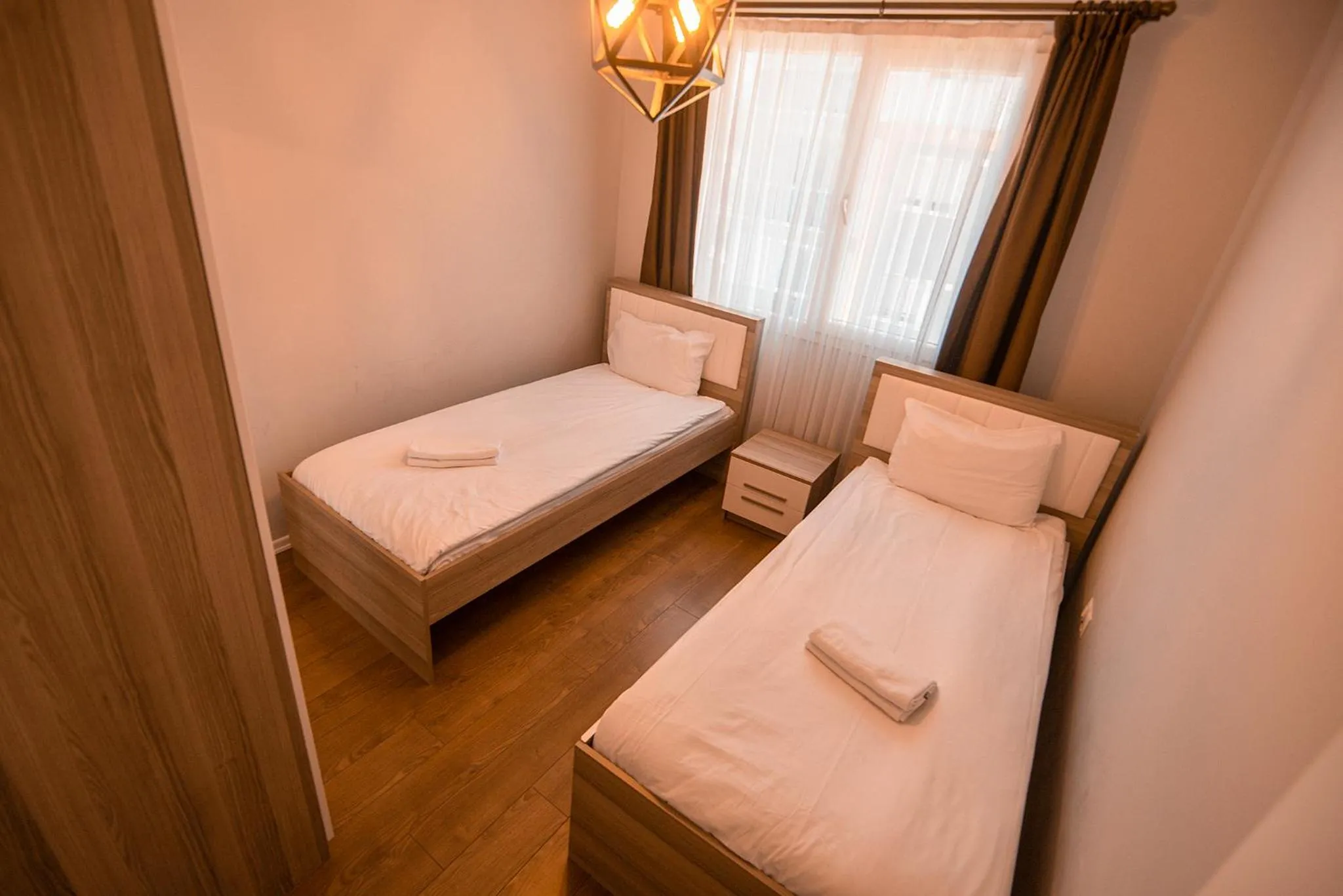 Bed in Royal Comfort Hotel