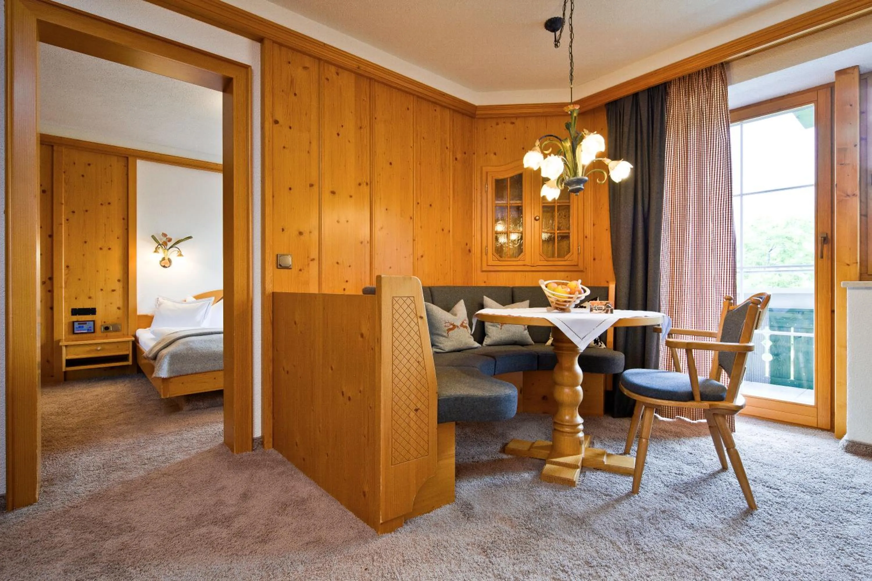 Living room, Bed in Haller's Geniesserhotel