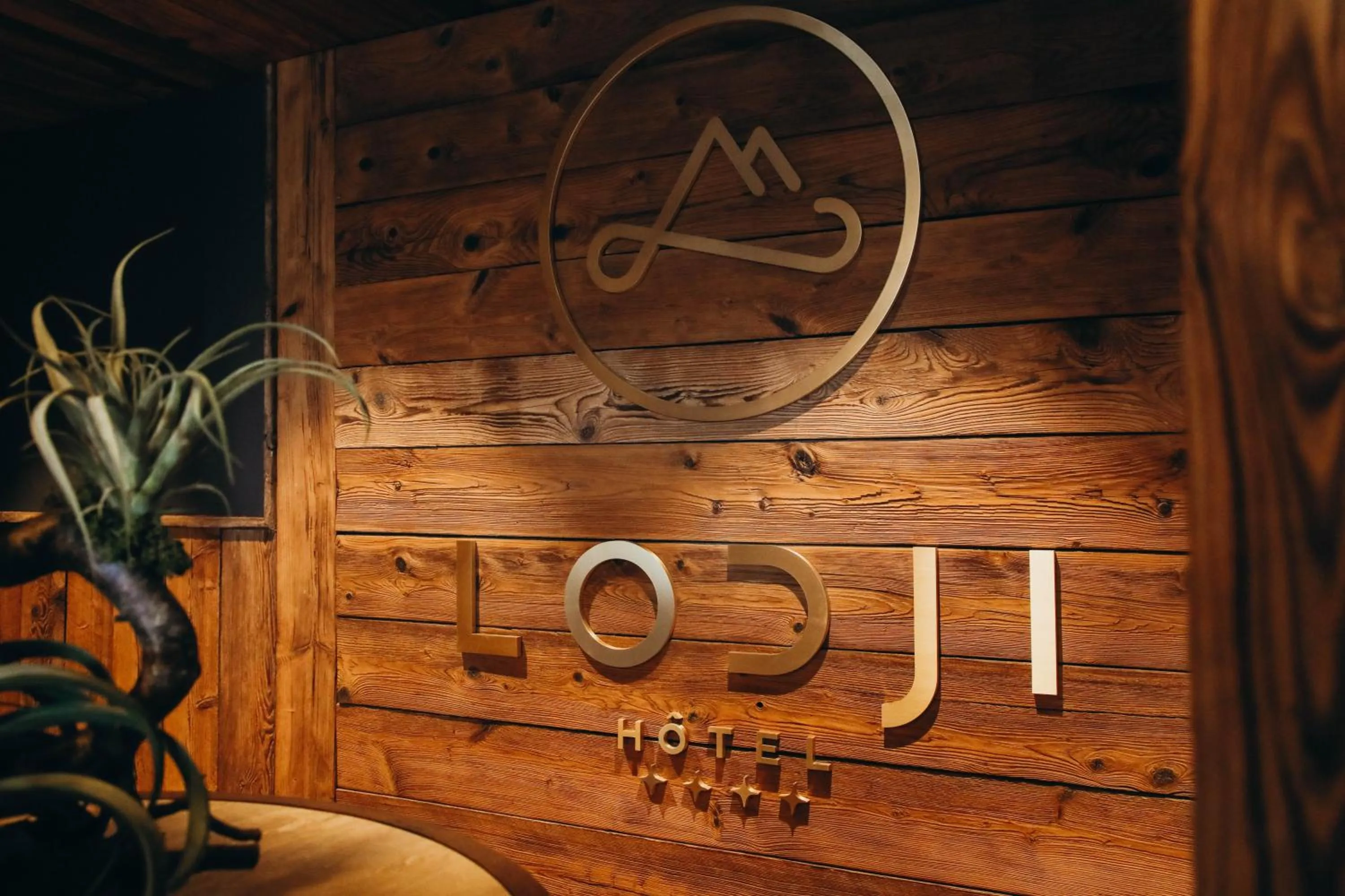 Property logo or sign in Lodji Hotel & spa