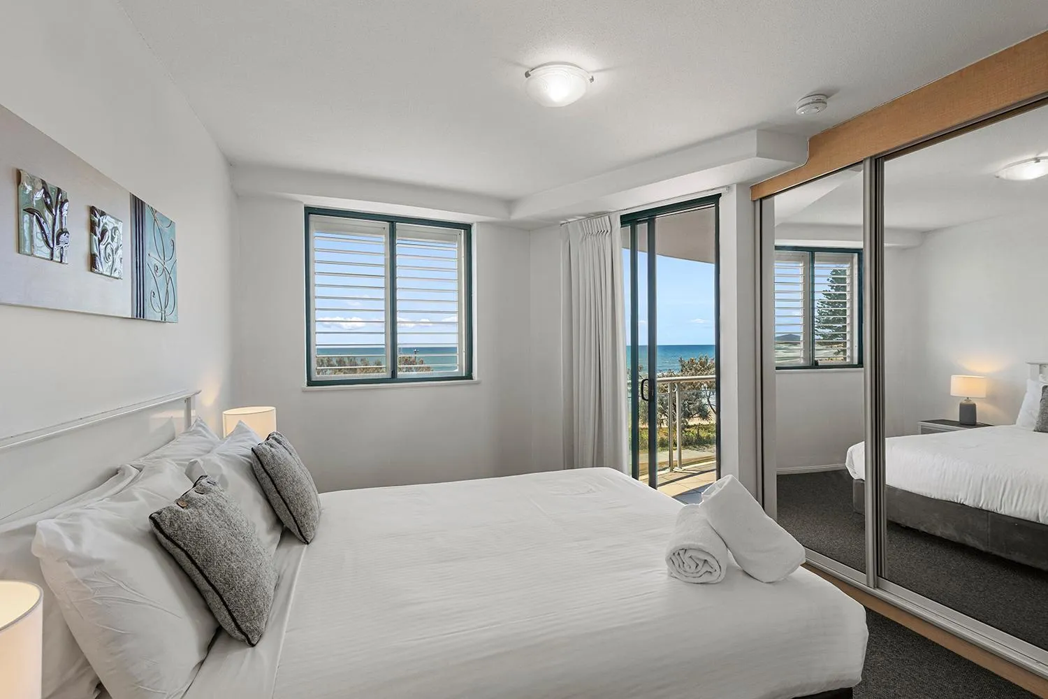 Bed in Grand Palais Boolarong Beachside Apartments