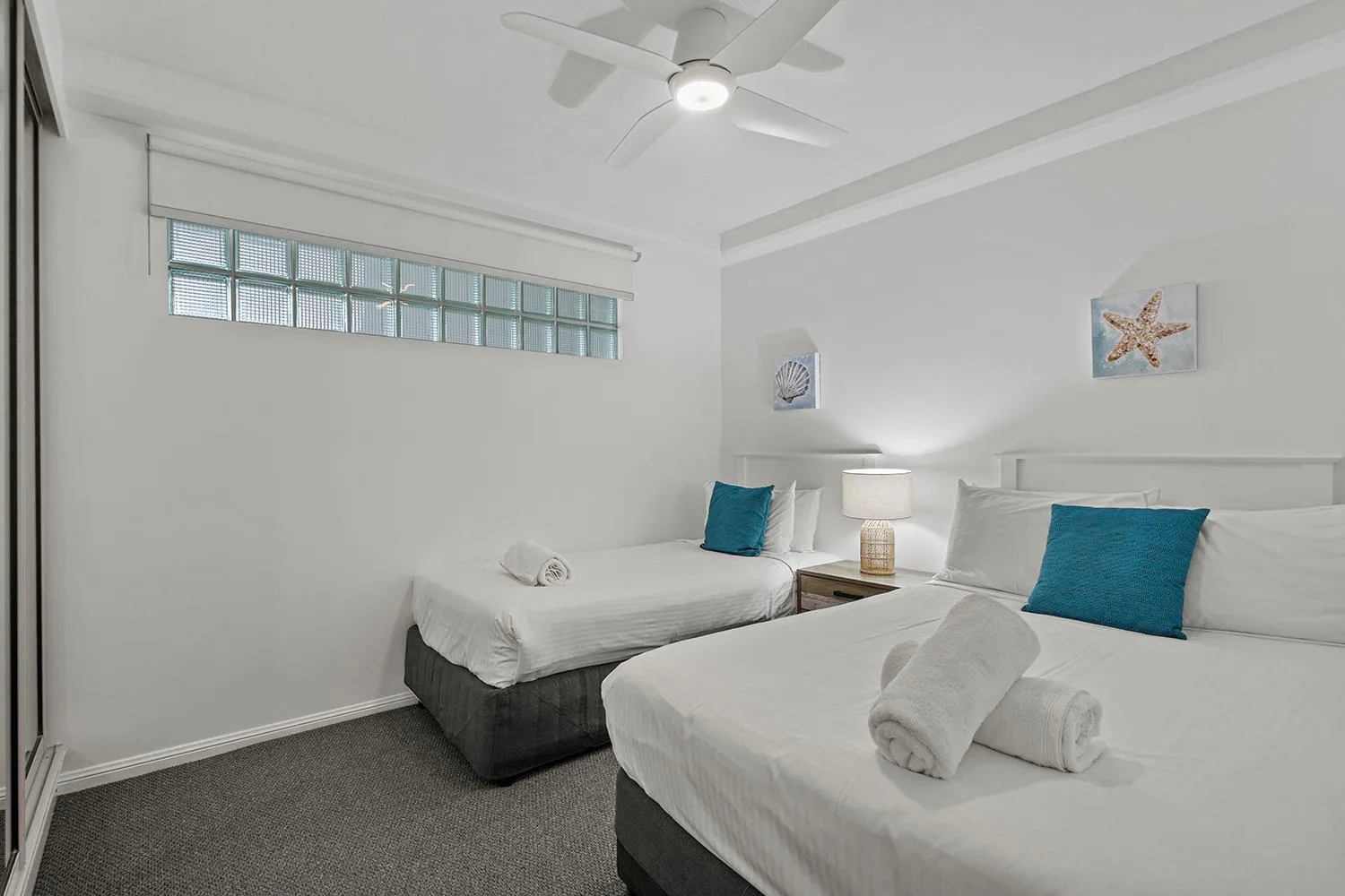 Bed in Grand Palais Boolarong Beachside Apartments