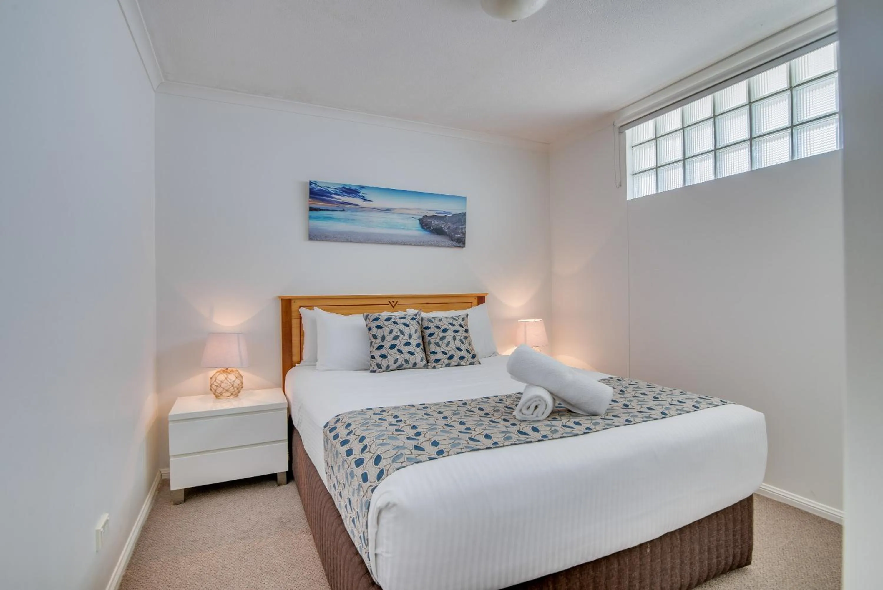 Bed in Grand Palais Boolarong Beachside Apartments