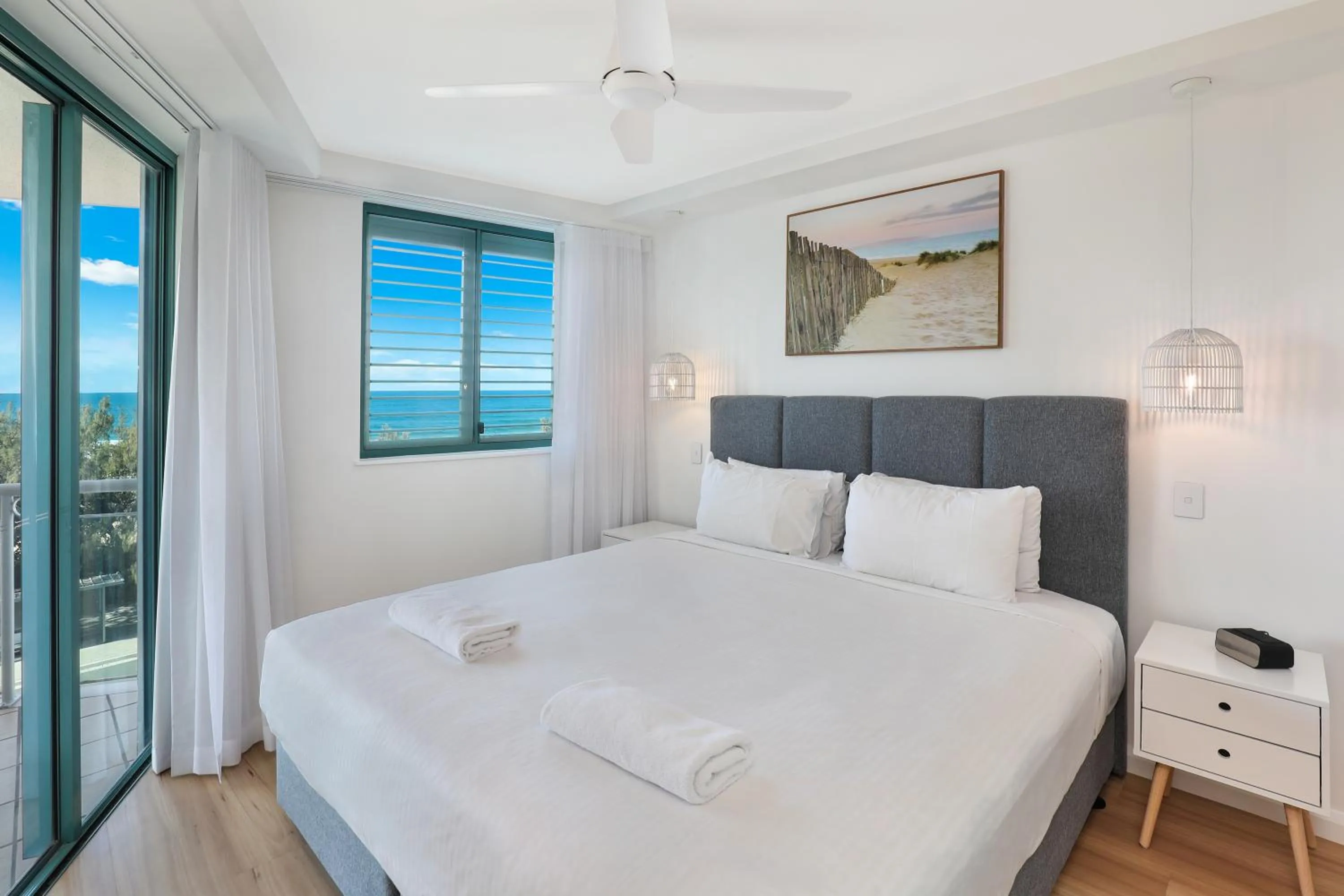 Bed in Grand Palais Boolarong Beachside Apartments