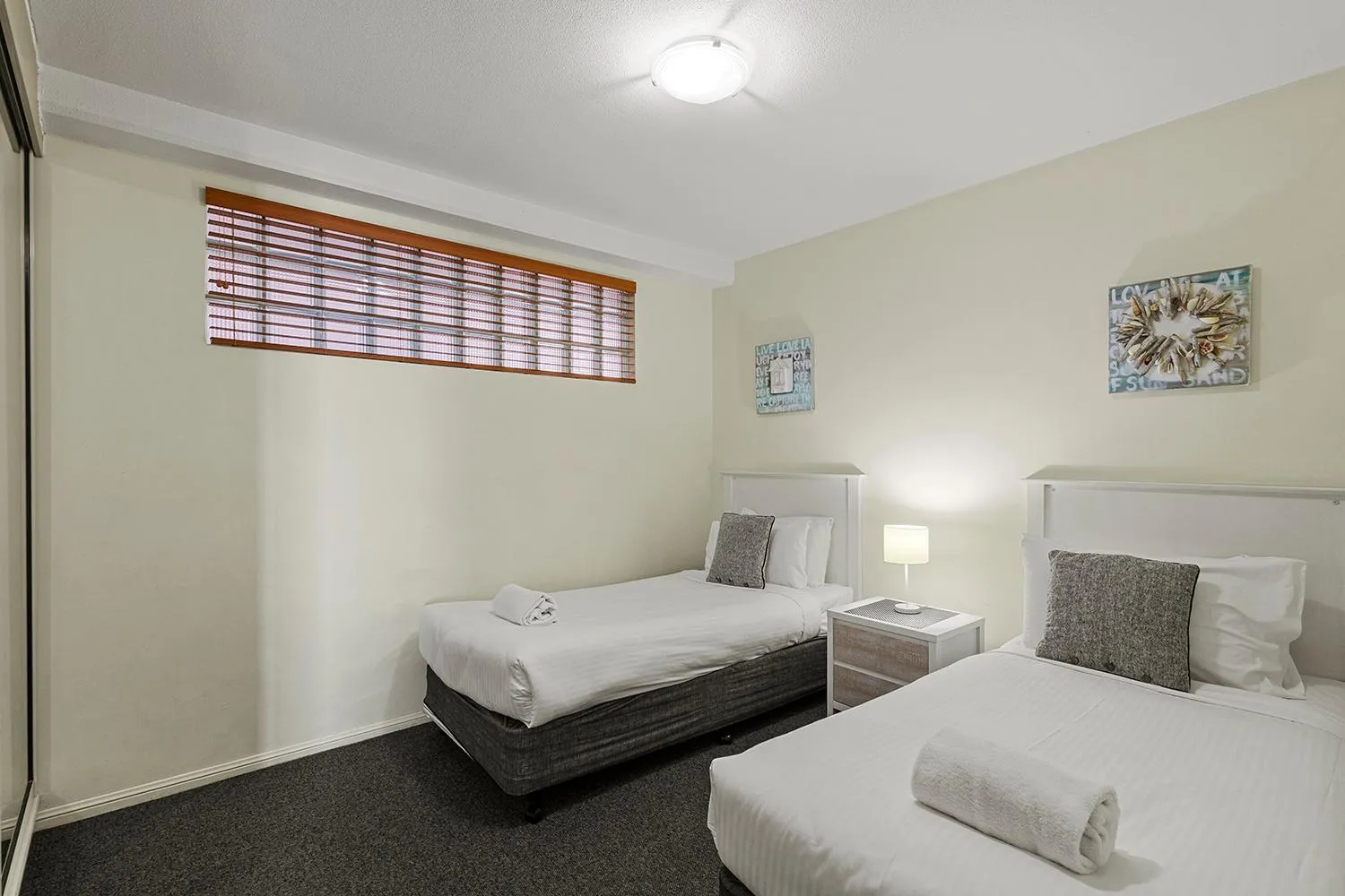 Bed in Grand Palais Boolarong Beachside Apartments