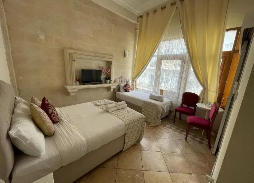 Bed in Lord's Residence Boutique Hotel