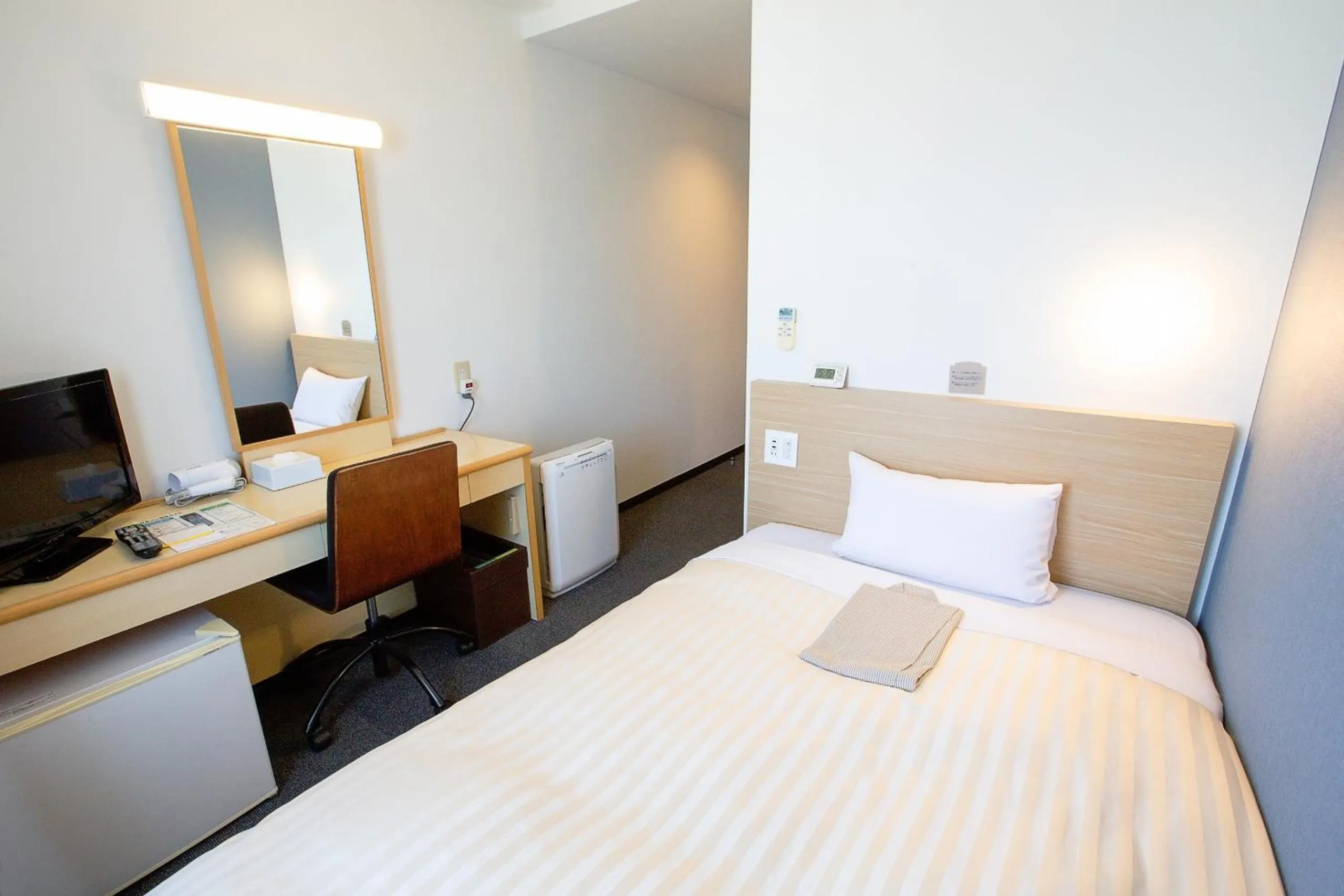 Bed in Super Hotel Matsuyama