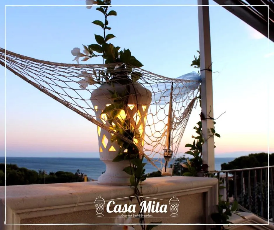 Property logo or sign in Casa Mita