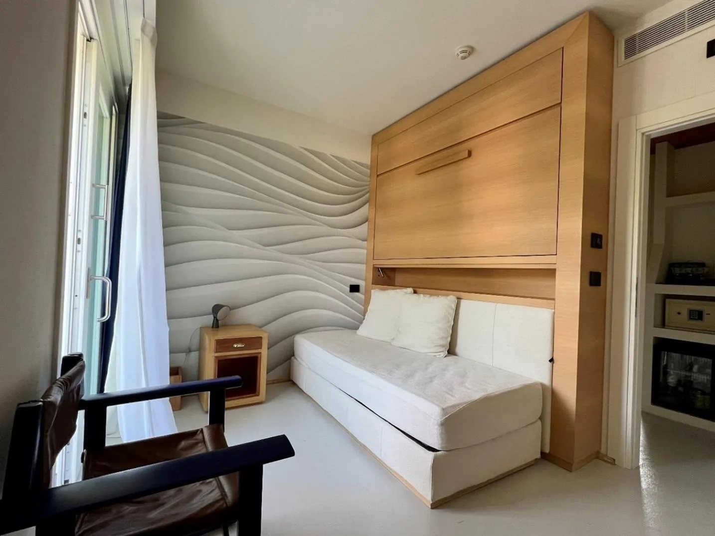 Seating area, Bed in Augustus Hotel & Resort