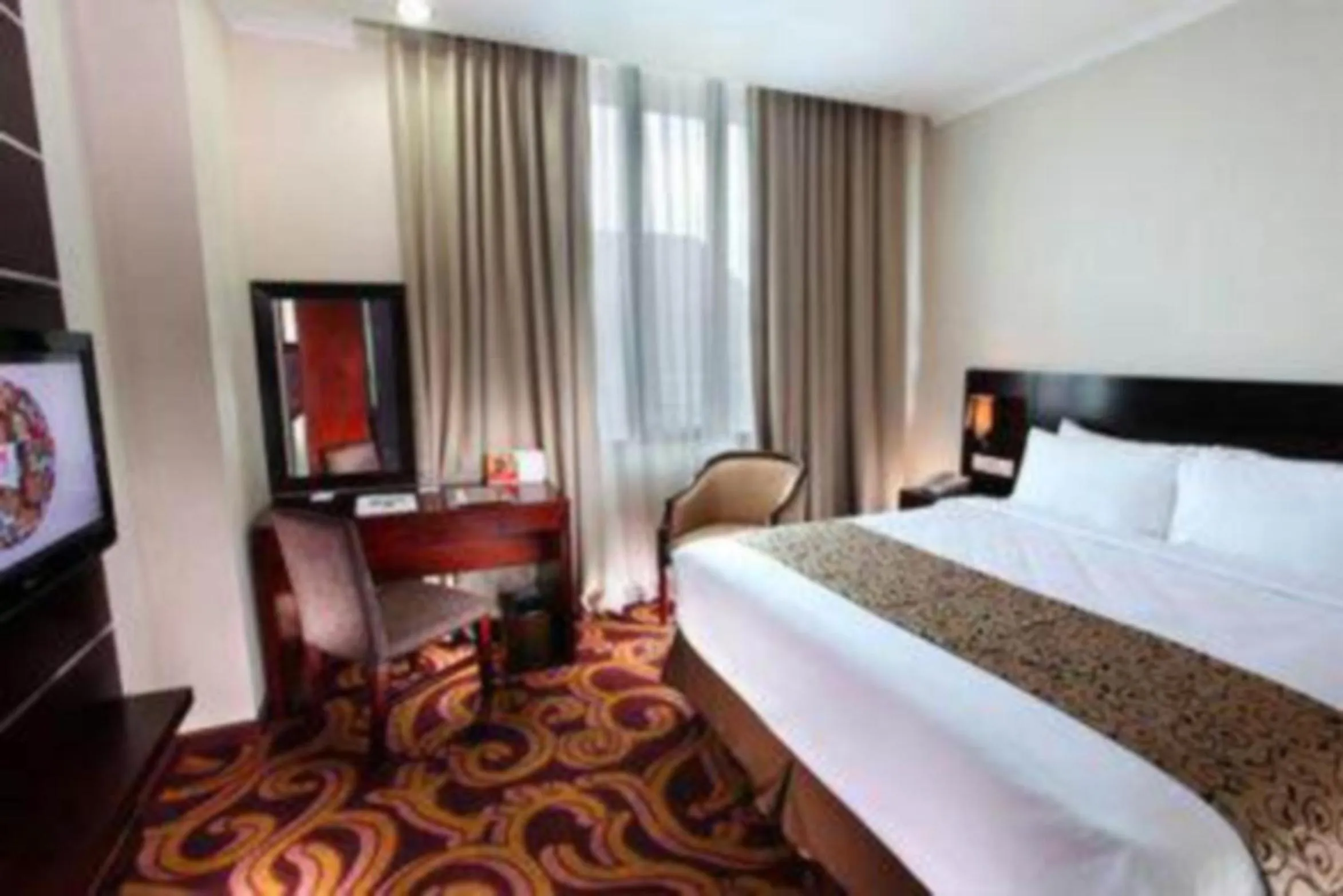 Bed in Swiss-Belhotel Merauke