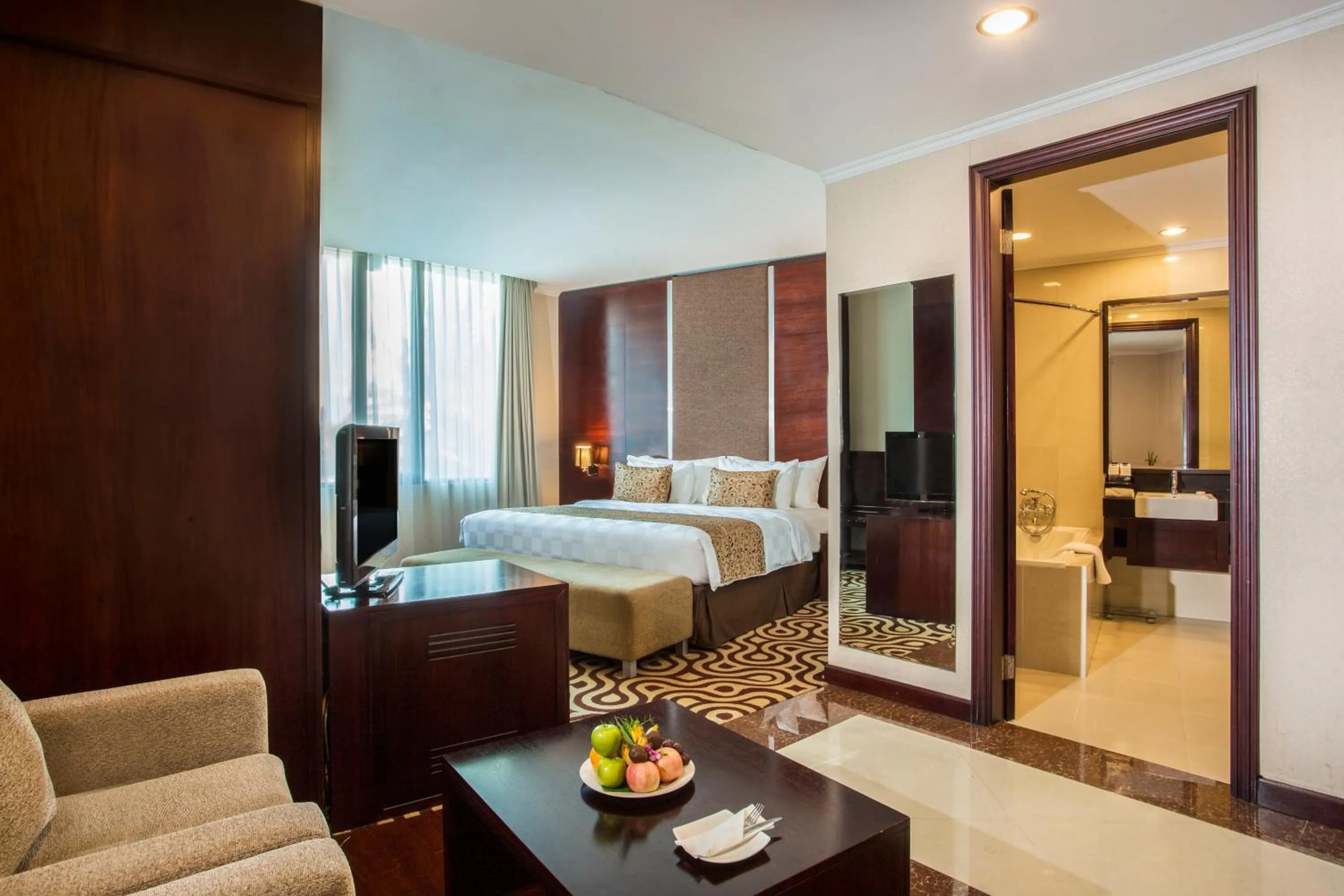 Living room, Bed in Swiss-Belhotel Merauke