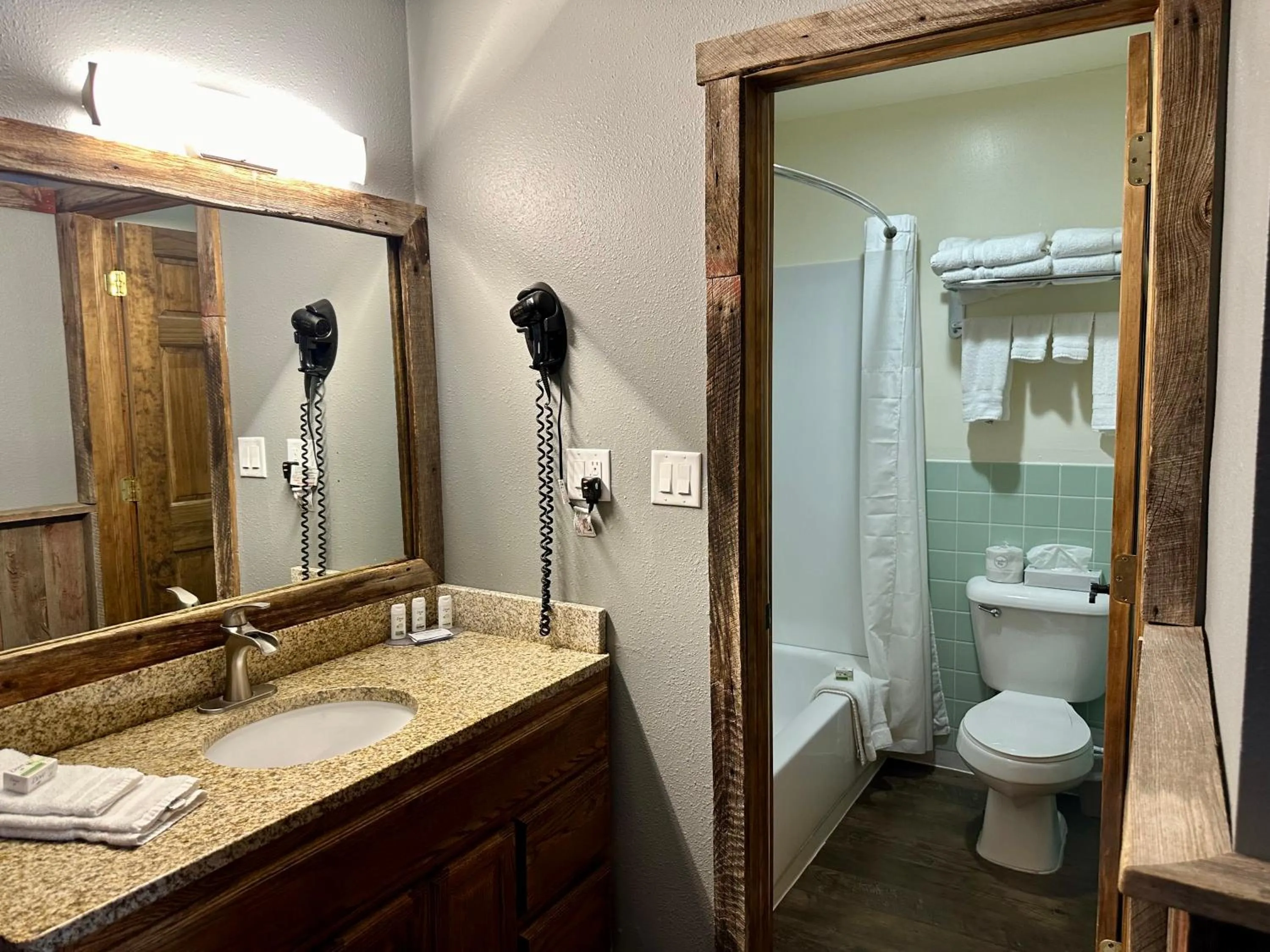 Shower in Americas Best Value Inn Wall