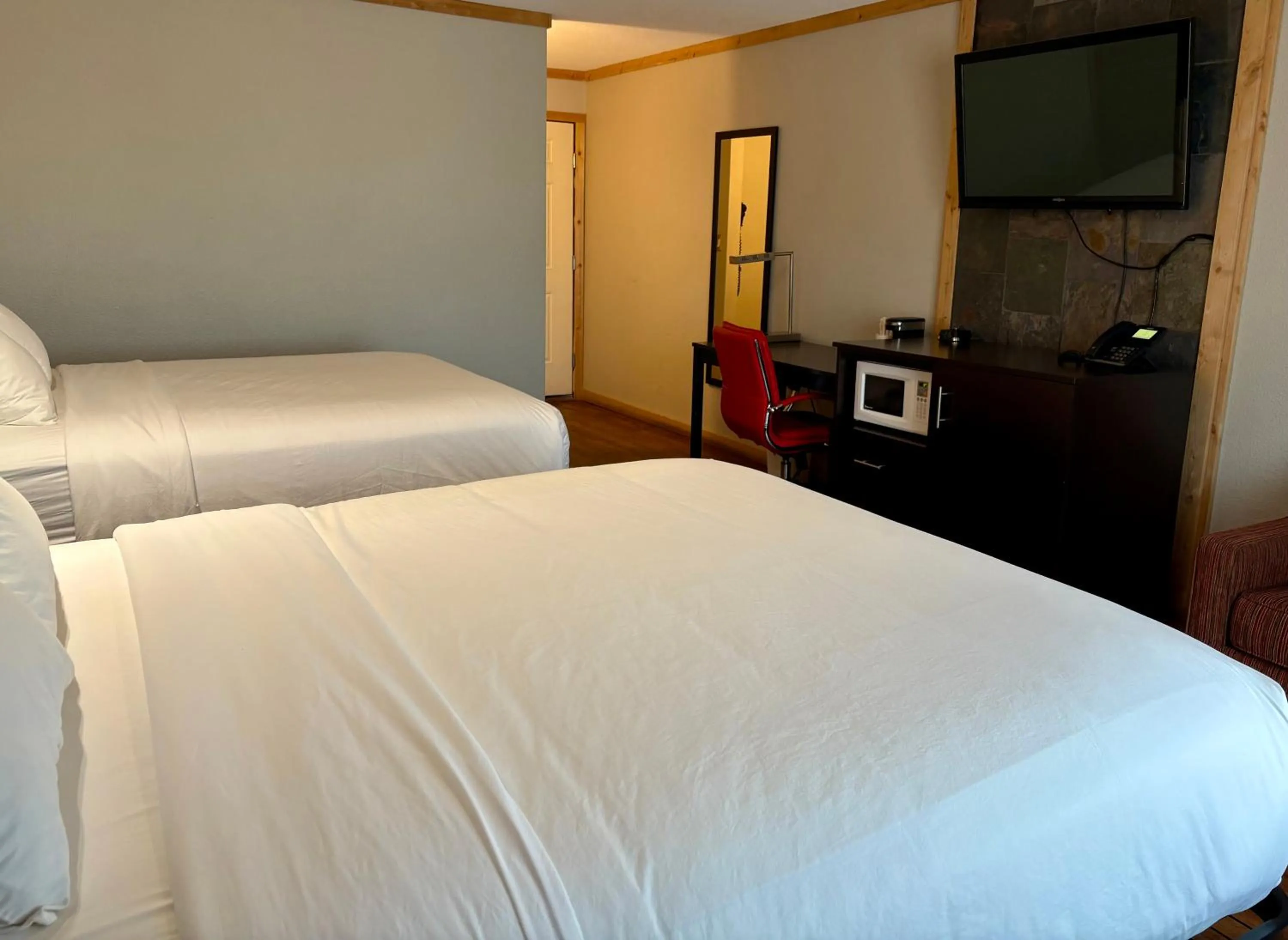 Bed in Americas Best Value Inn Wall