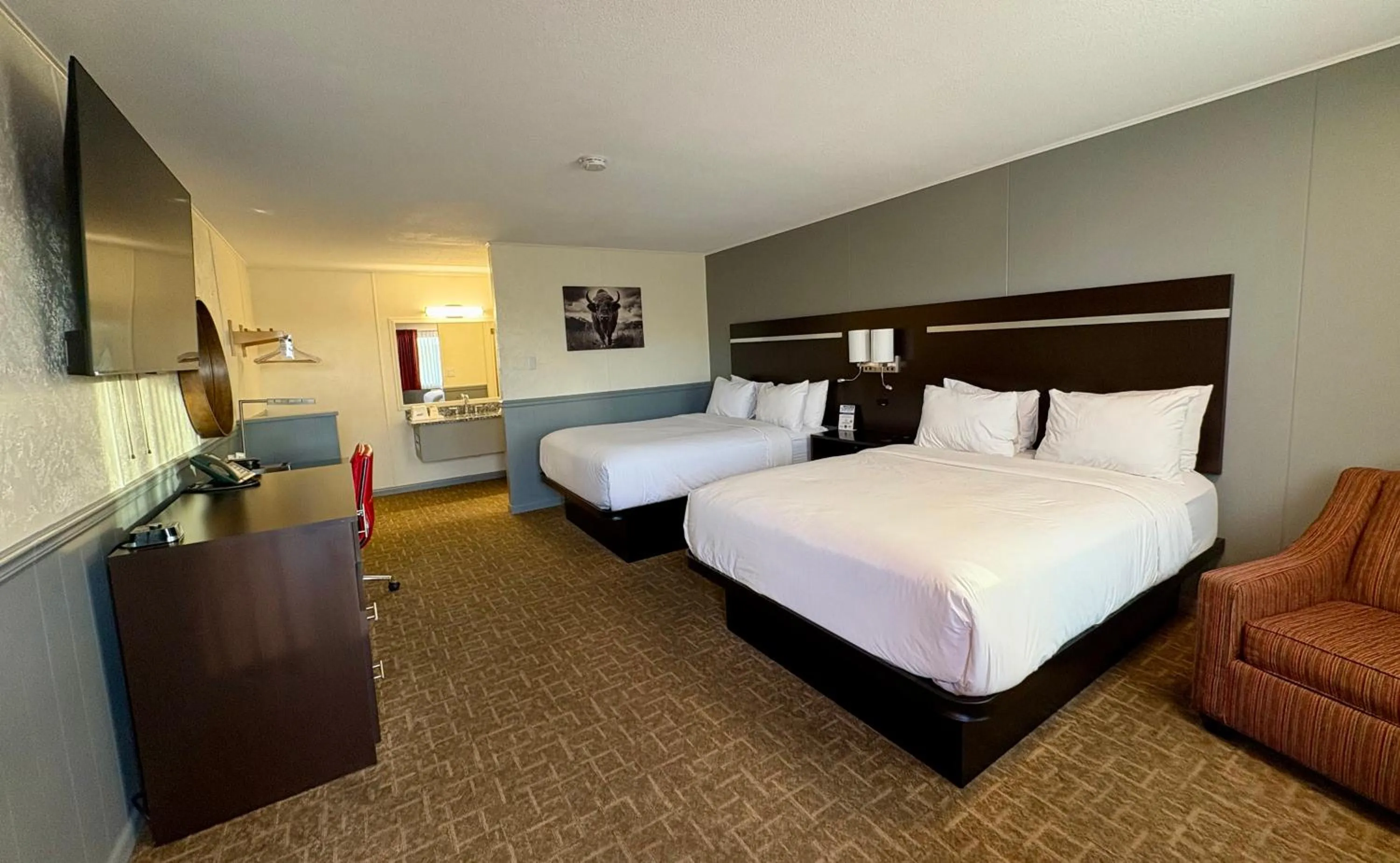 Bed in Americas Best Value Inn Wall