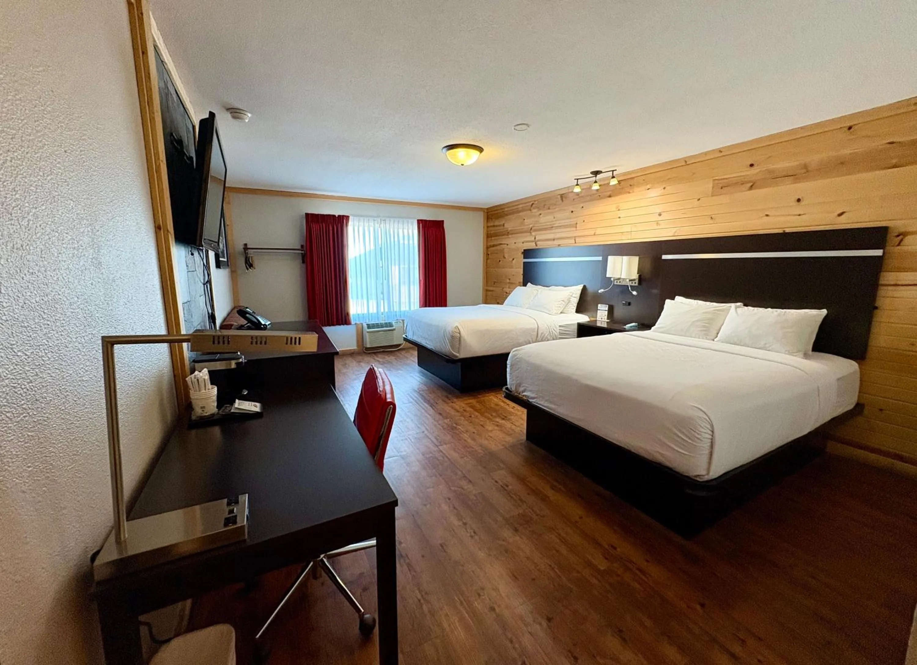 Bed in Americas Best Value Inn Wall