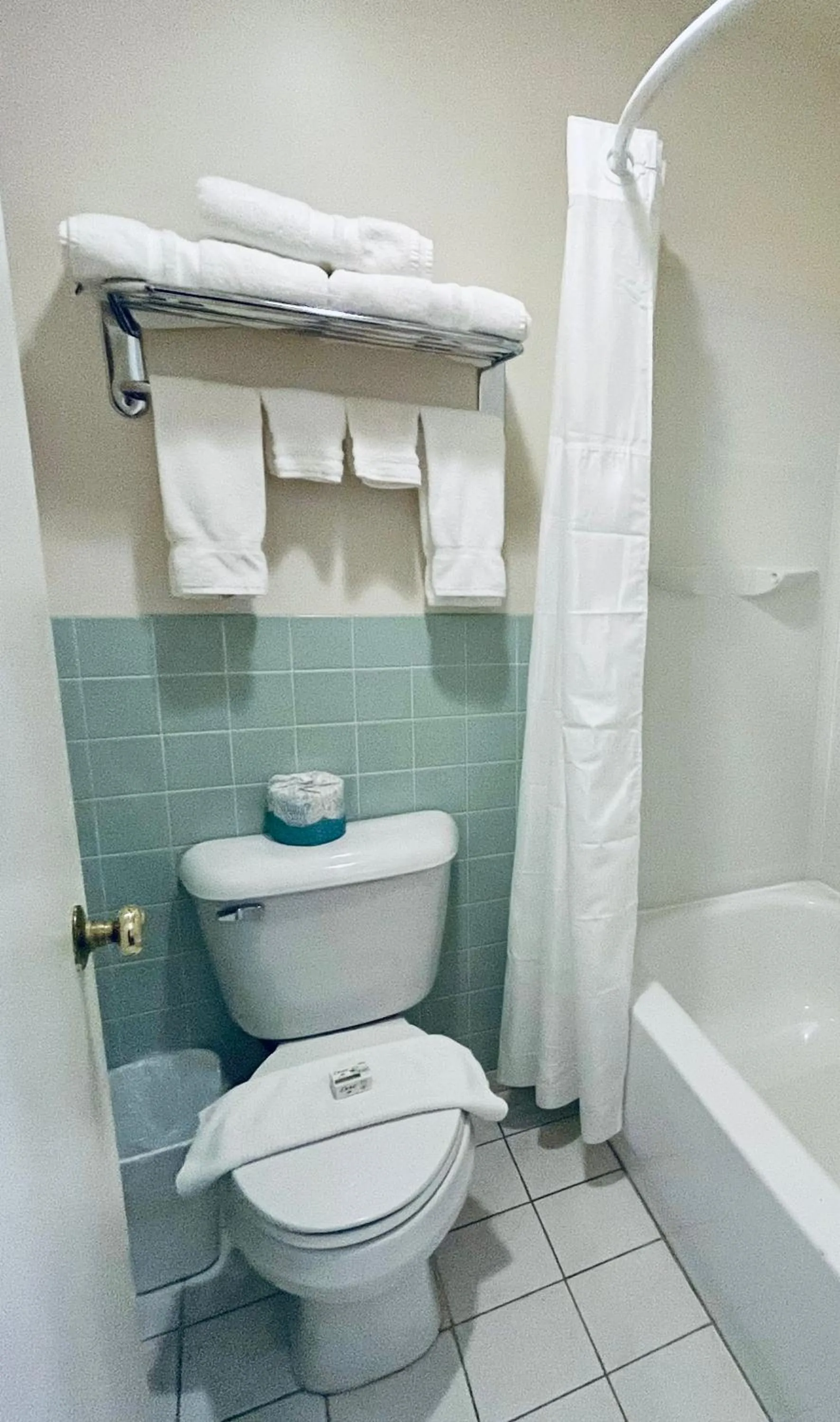 Shower in Americas Best Value Inn Wall