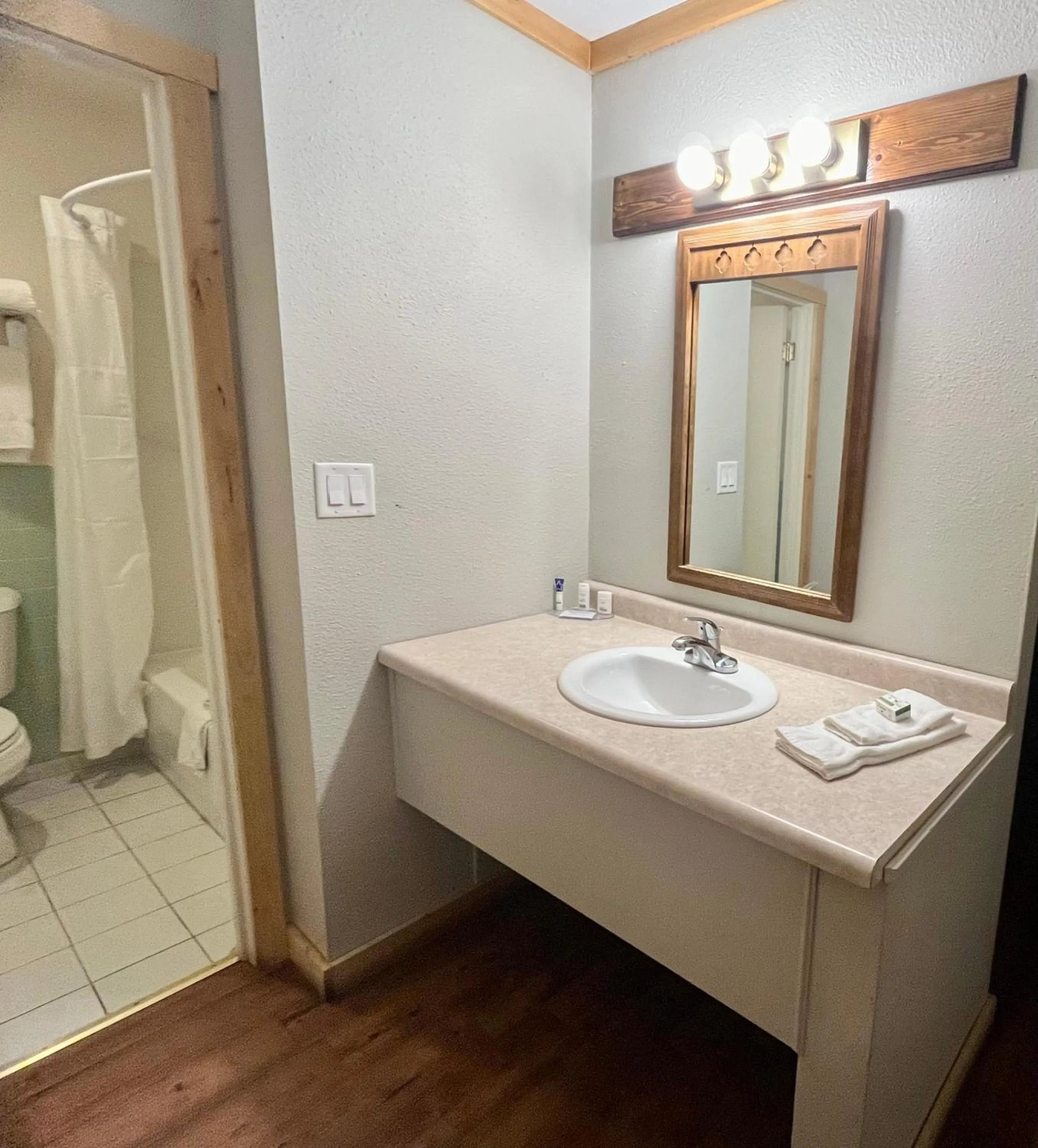 Shower in Americas Best Value Inn Wall