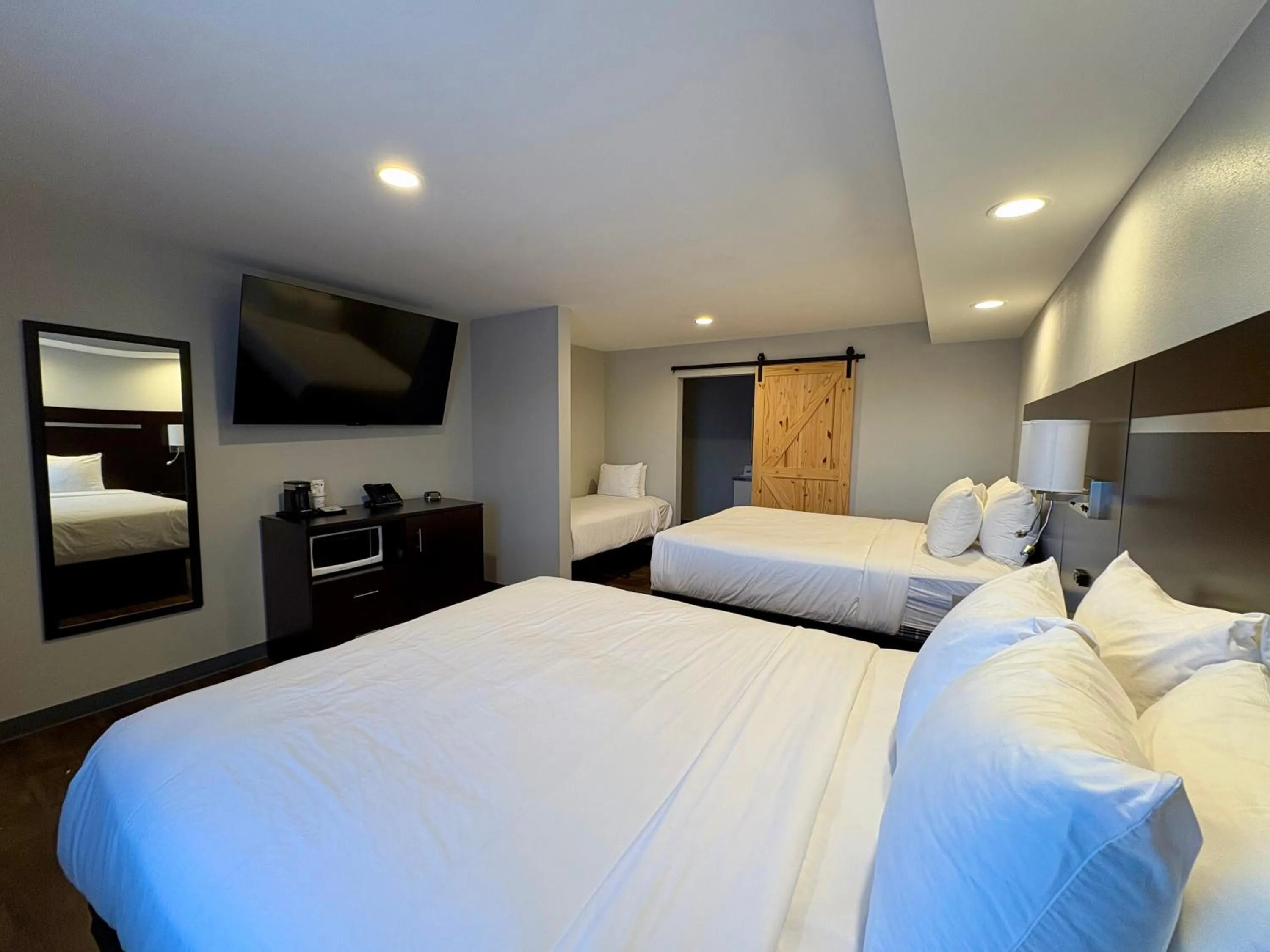 Bed in Americas Best Value Inn Wall