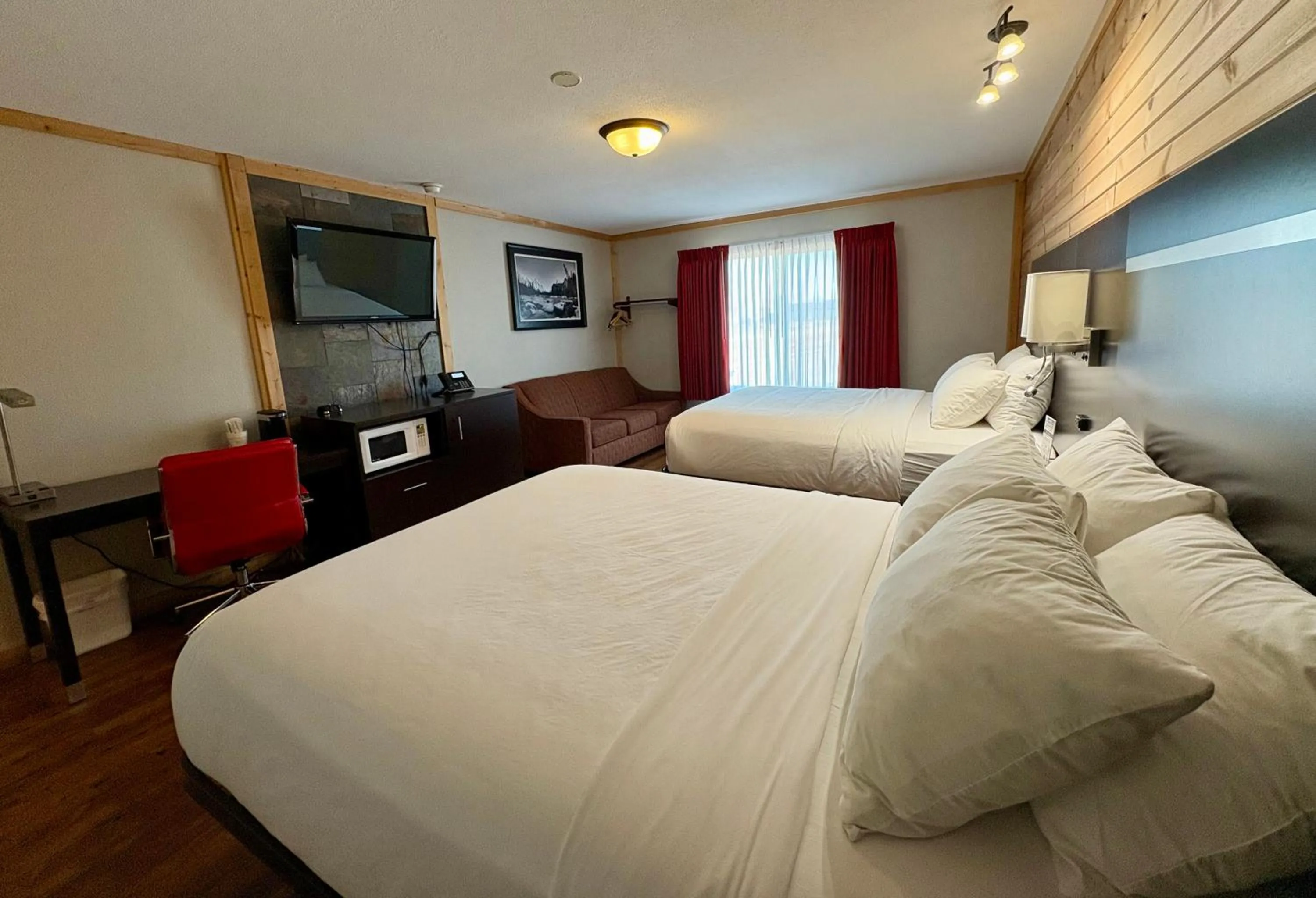 Bed in Americas Best Value Inn Wall