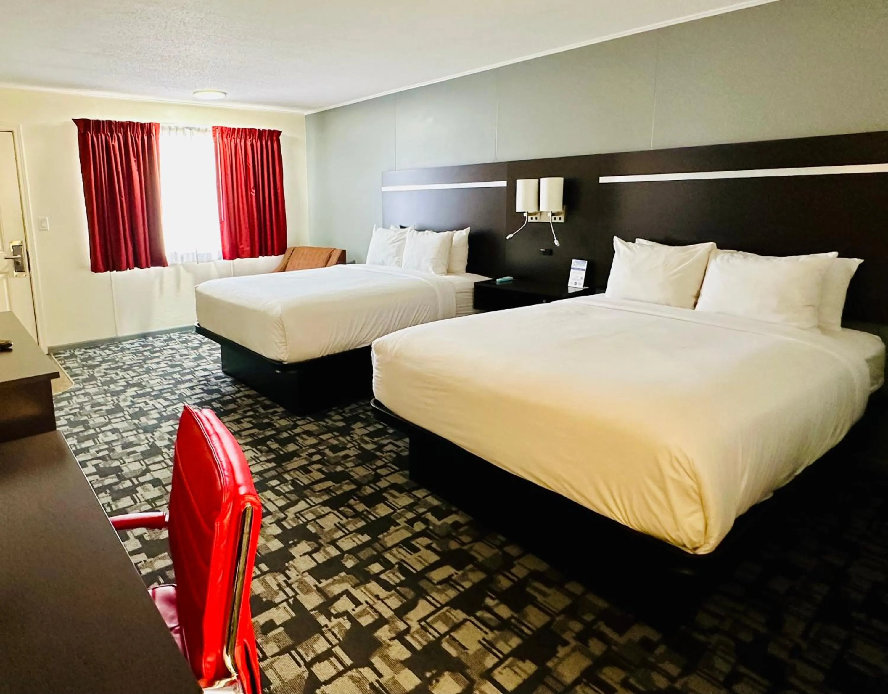 Bed in Americas Best Value Inn Wall