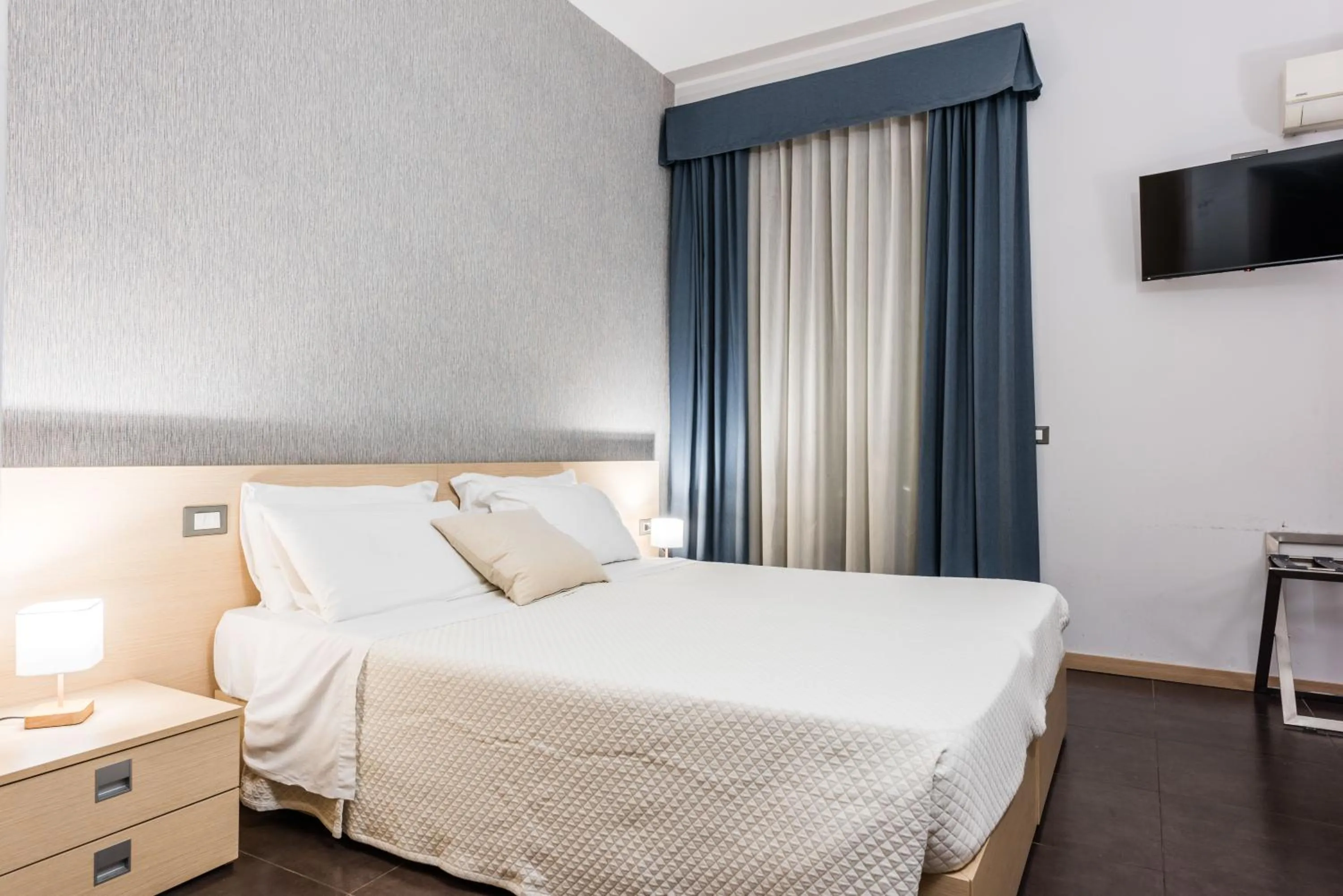 Bed in BeBIGEA Rooms