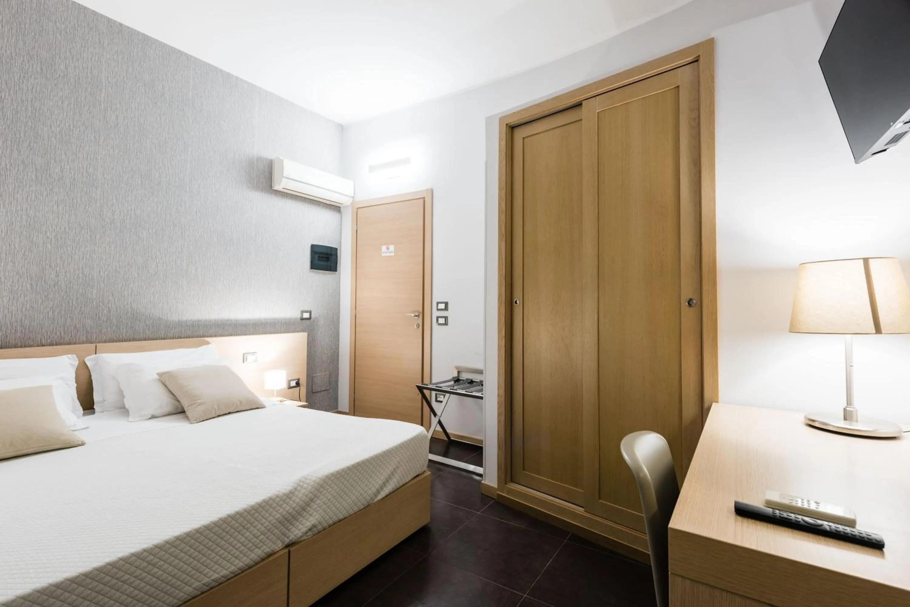 Bed in BeBIGEA Rooms