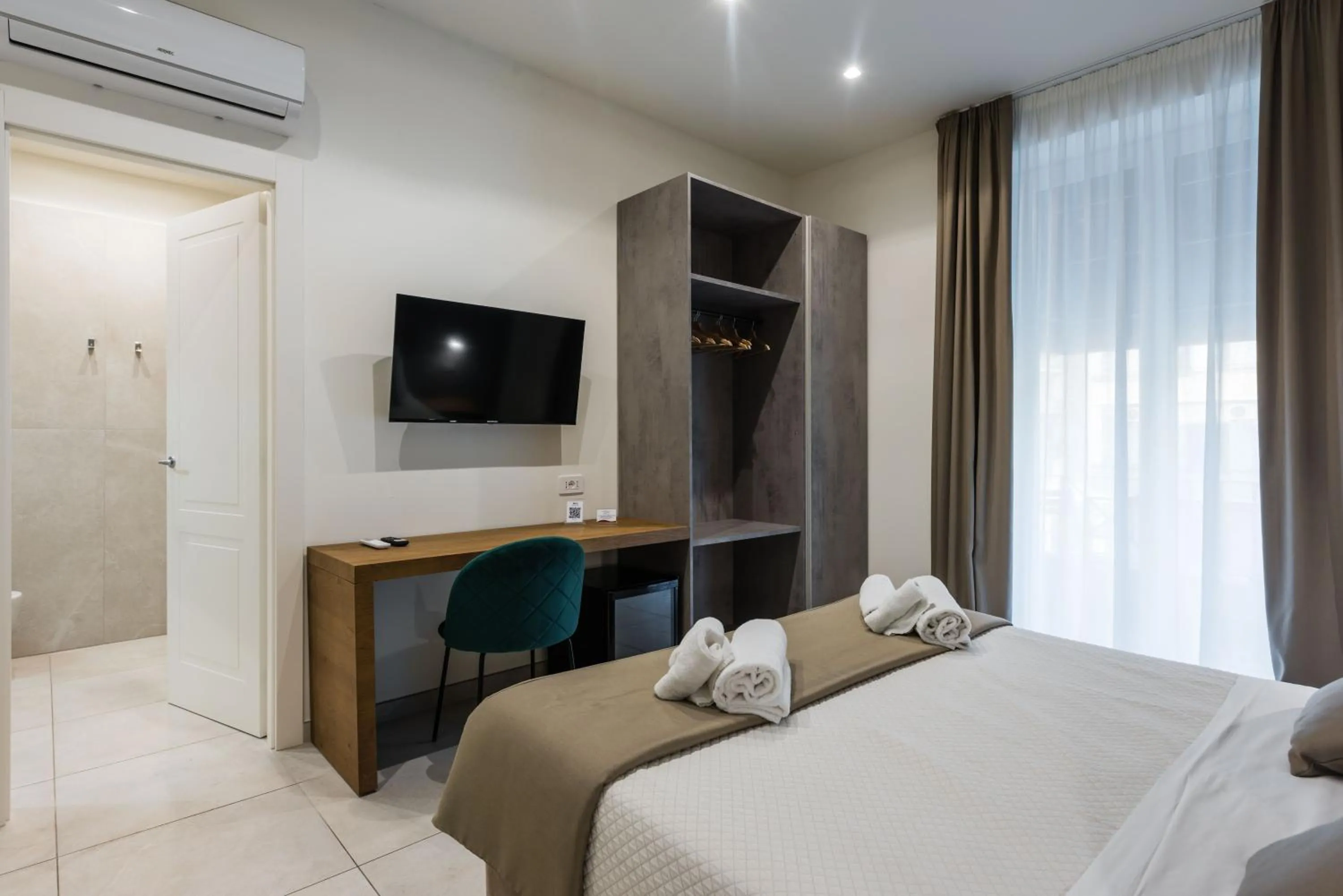 Bed in BeBIGEA Rooms