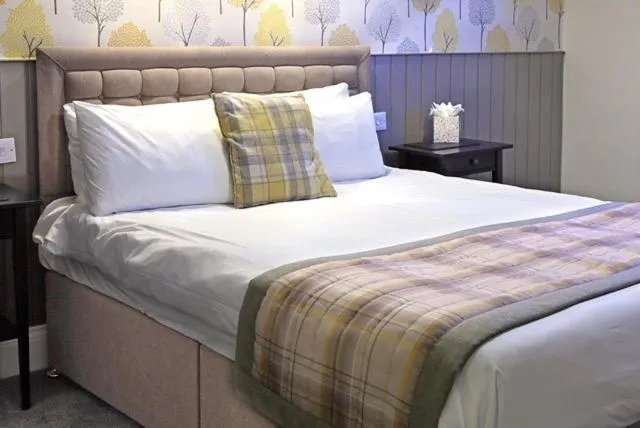 Bed in The Marine Hotel