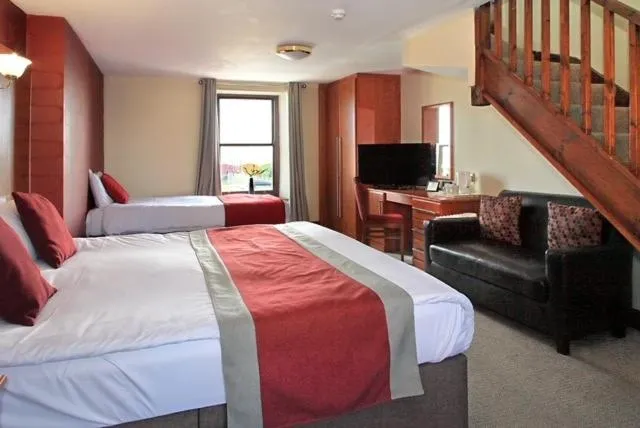 Bed in The Marine Hotel