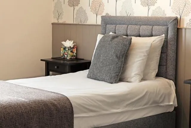 Bed in The Marine Hotel