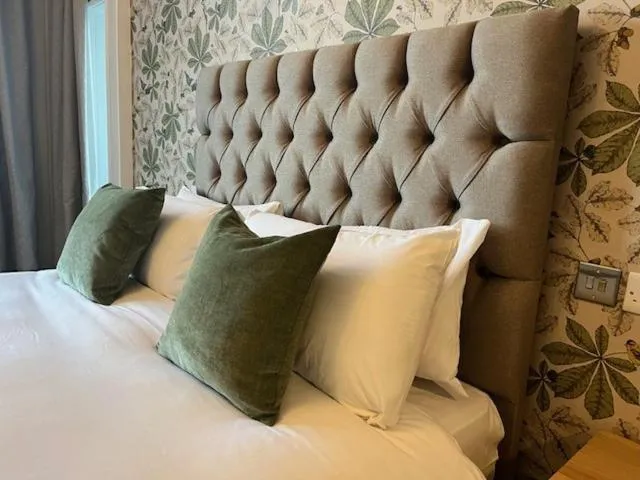 Bed in The Marine Hotel