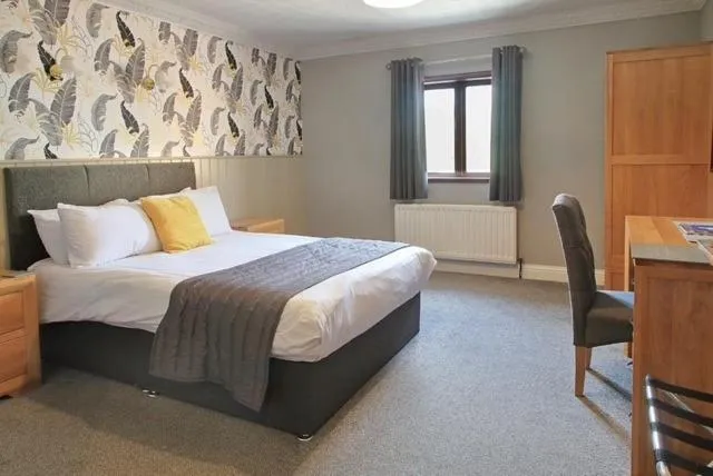 Bed in The Marine Hotel